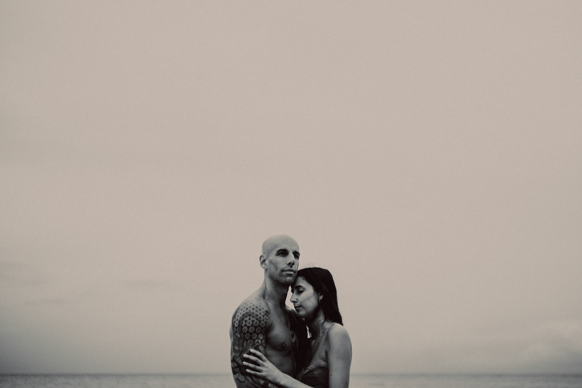 Intimate destination couple portraits at White Beach Station 1, in black and white, shot in front of Discovery Shores, Boracay, Philippines, Southeast Asia, December 2018, Sony A7III.