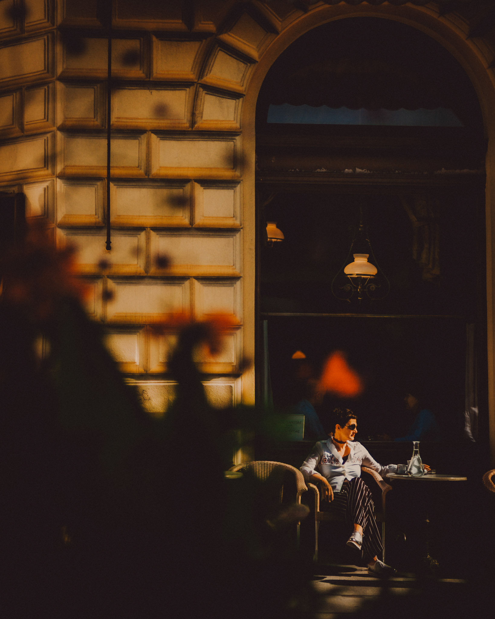 A woman wearing sunglasses outside Café Sperl, Vienna, Austria, August 2017, Leica M.