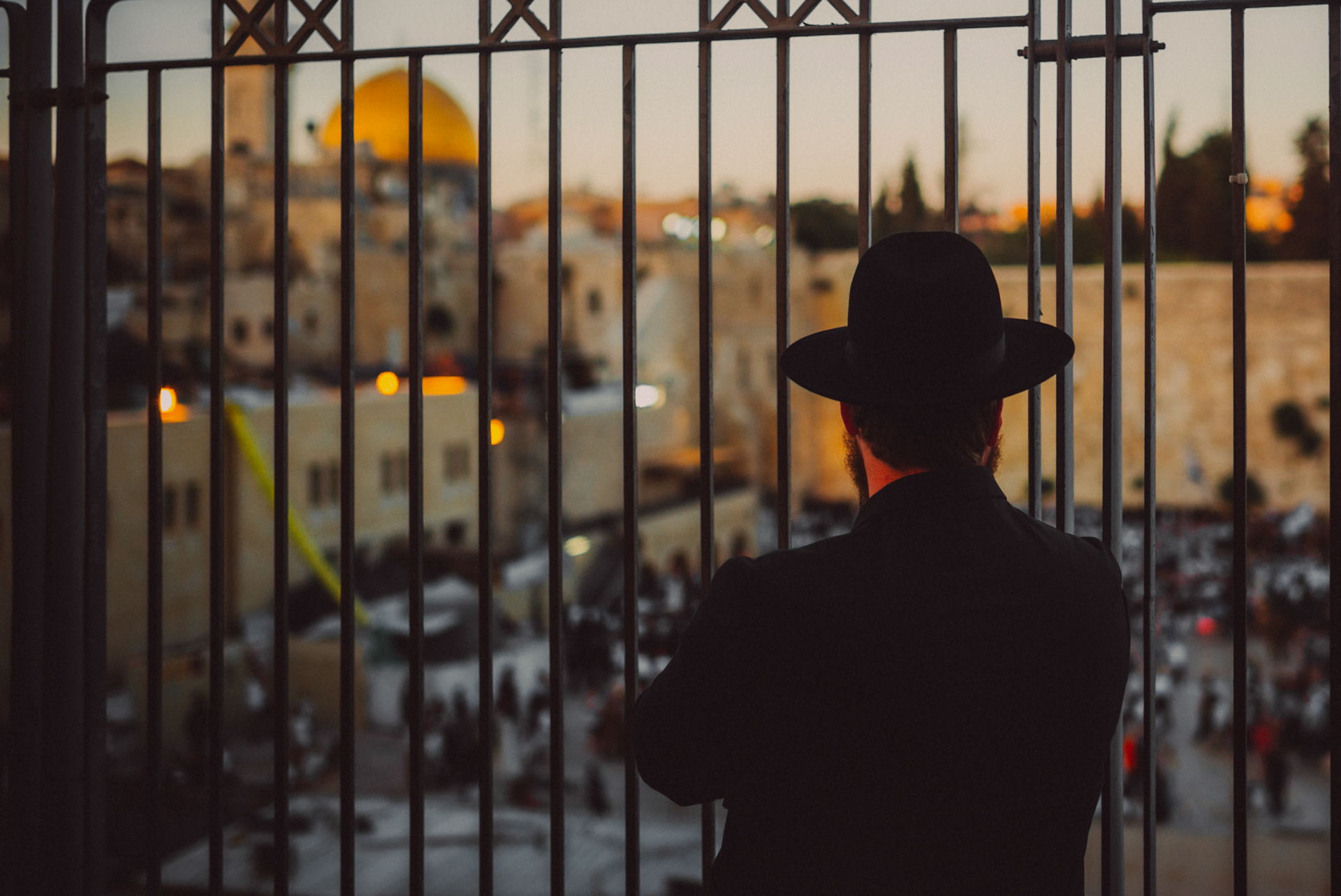 A Jewish Rabii observing the Western Wall from behind a steel fence, Jerusalem, Israel, July 2015, Leica M.