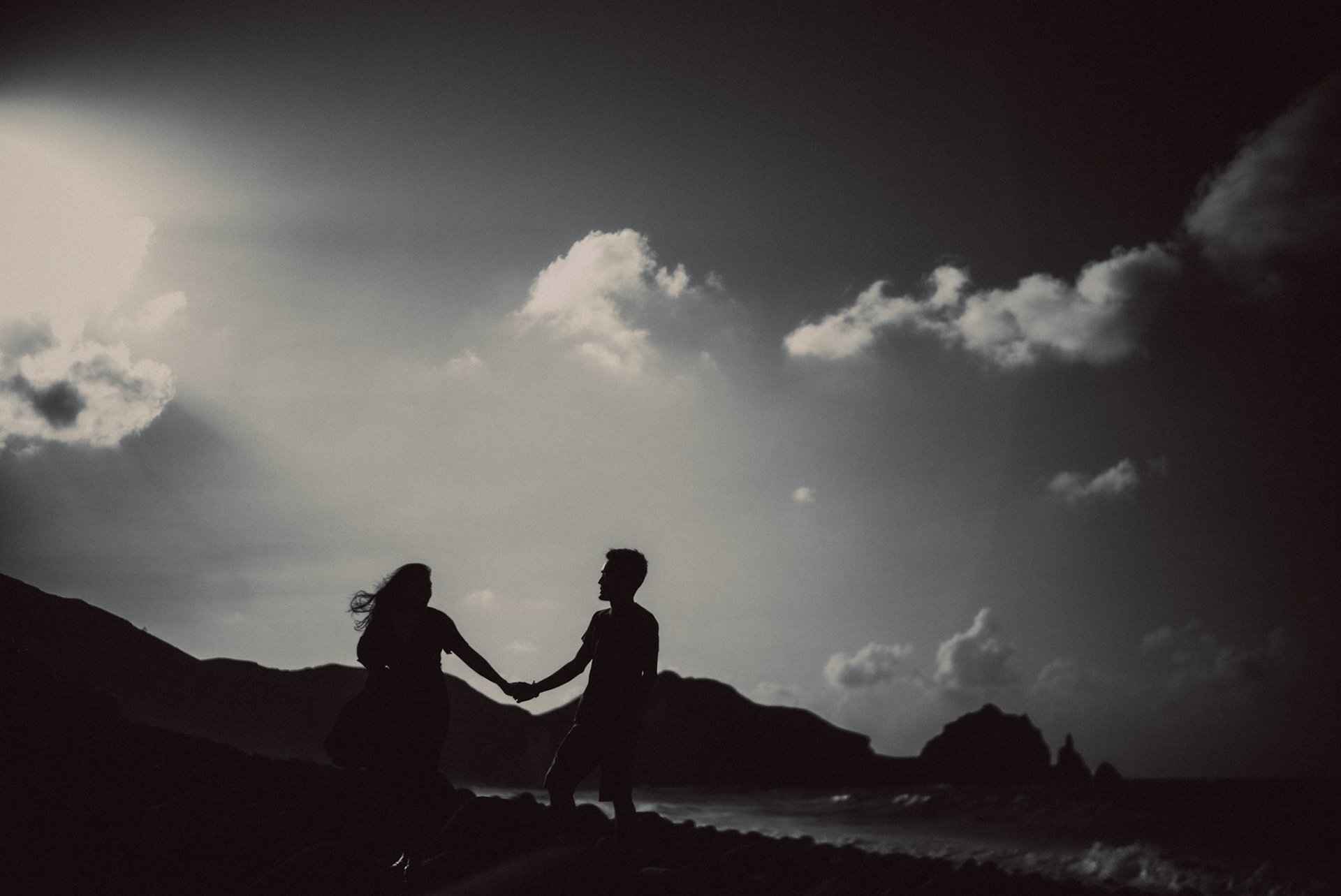 Moody couple portraits, in black and white, from Owen and Nikka's adventure prenup photoshoot in Chadpidan Boulder Beach, Batanes, Philippines, October 2017, Leica M.