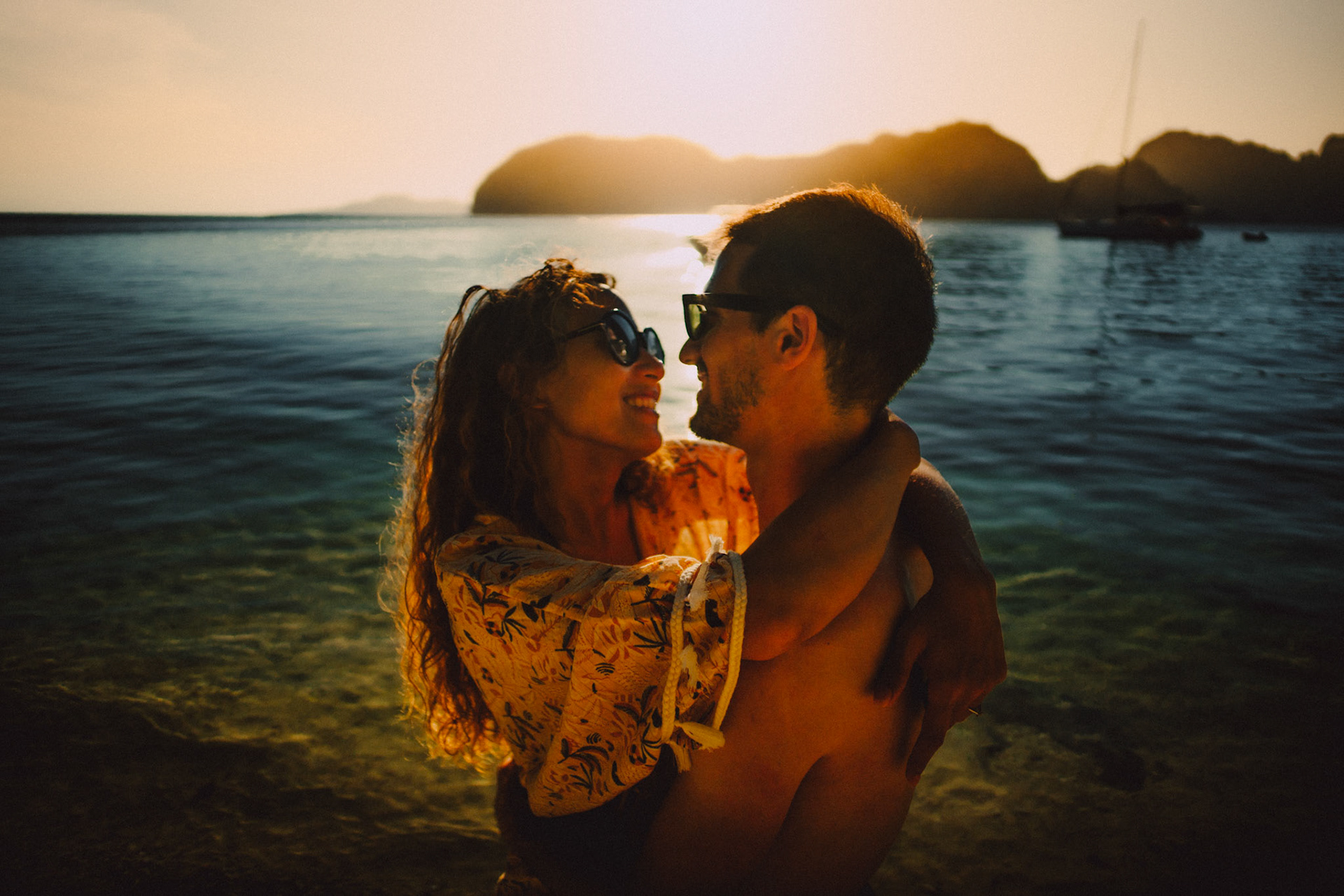 Intimate adventure couple portraits in Entalula Island's secluded west-facing beach just moments before sunset, El Nido, Palawan, Philippines, Southeast Asia, April 2019, Sony A7III.