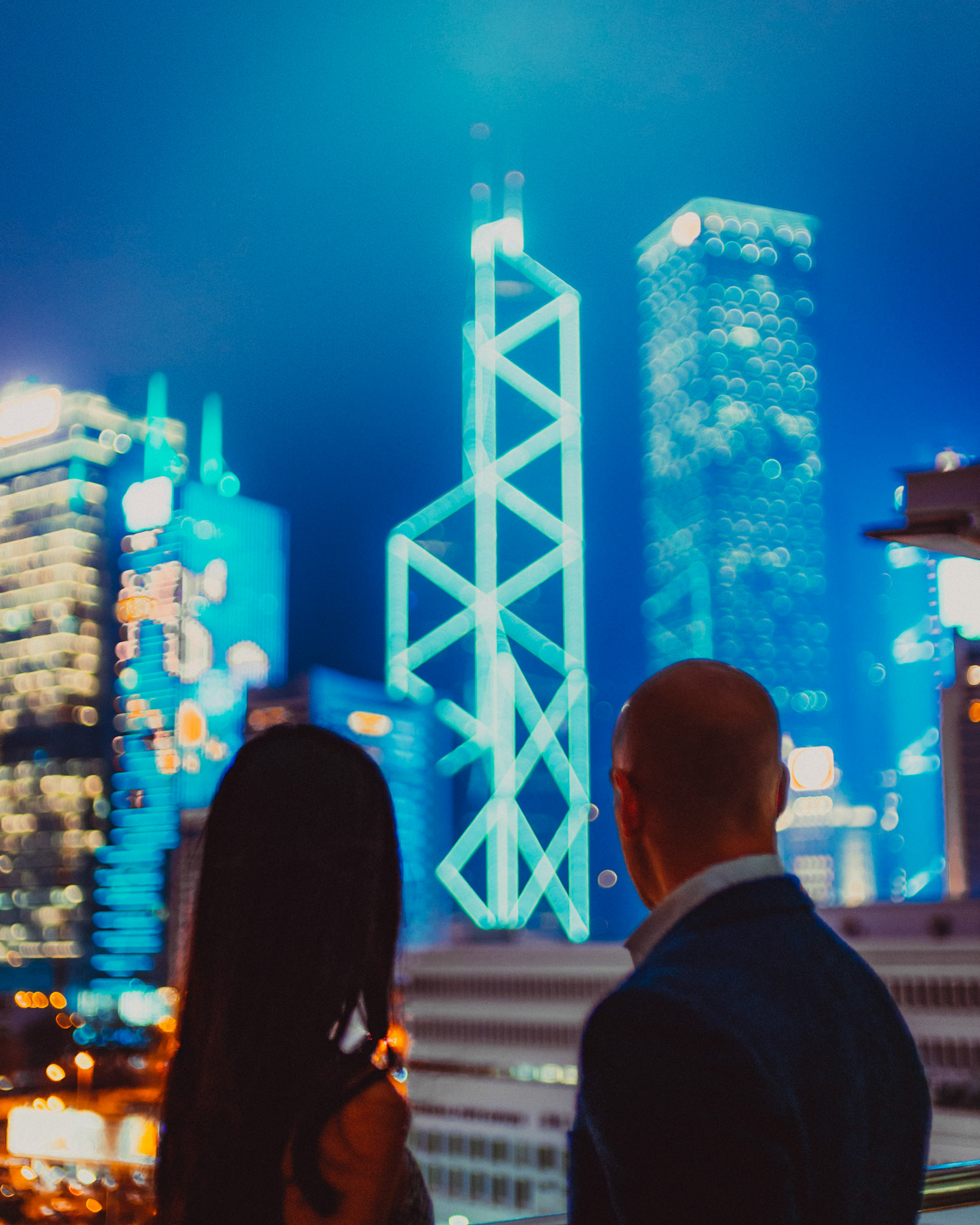 Late night couple portraits with the Bank of China Tower in the background, from Eric and Sabrina's engagement shoot in Central, Hong Kong, April 2019, Sony A7III.