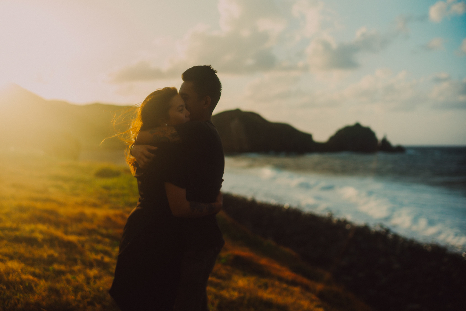 Cinematic sunset couple portraits on a seaside cliff, from Owen and Nikka's adventure prenup photoshoot in Chadpidan Boulder Beach, Batanes, Philippines, Southeast Asia, October 2017, Leica M.