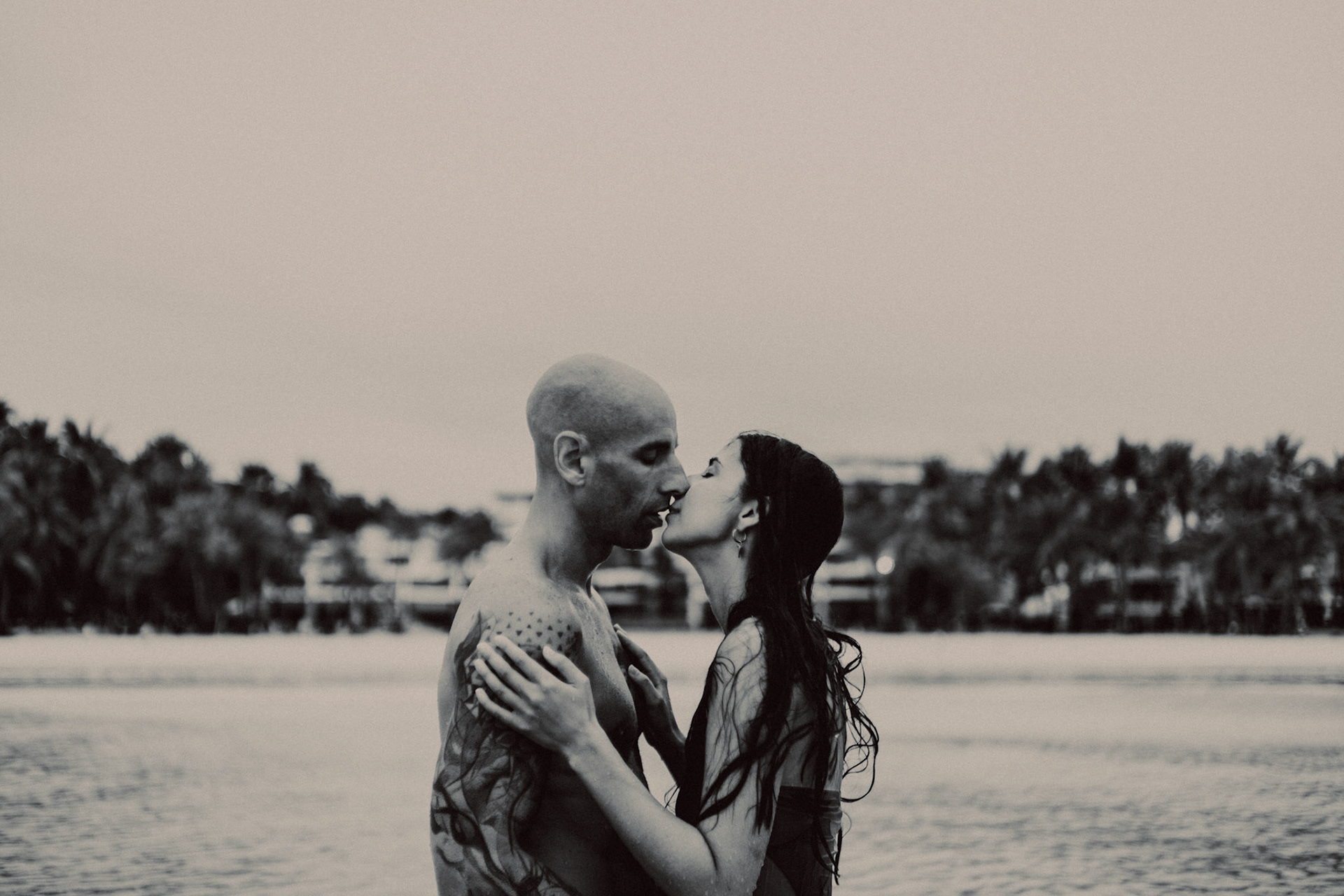 Intimate destination couple portraits at White Beach Station 1, in black and white, shot in front of Discovery Shores, Boracay, Philippines, Southeast Asia, December 2018, Sony A7III.