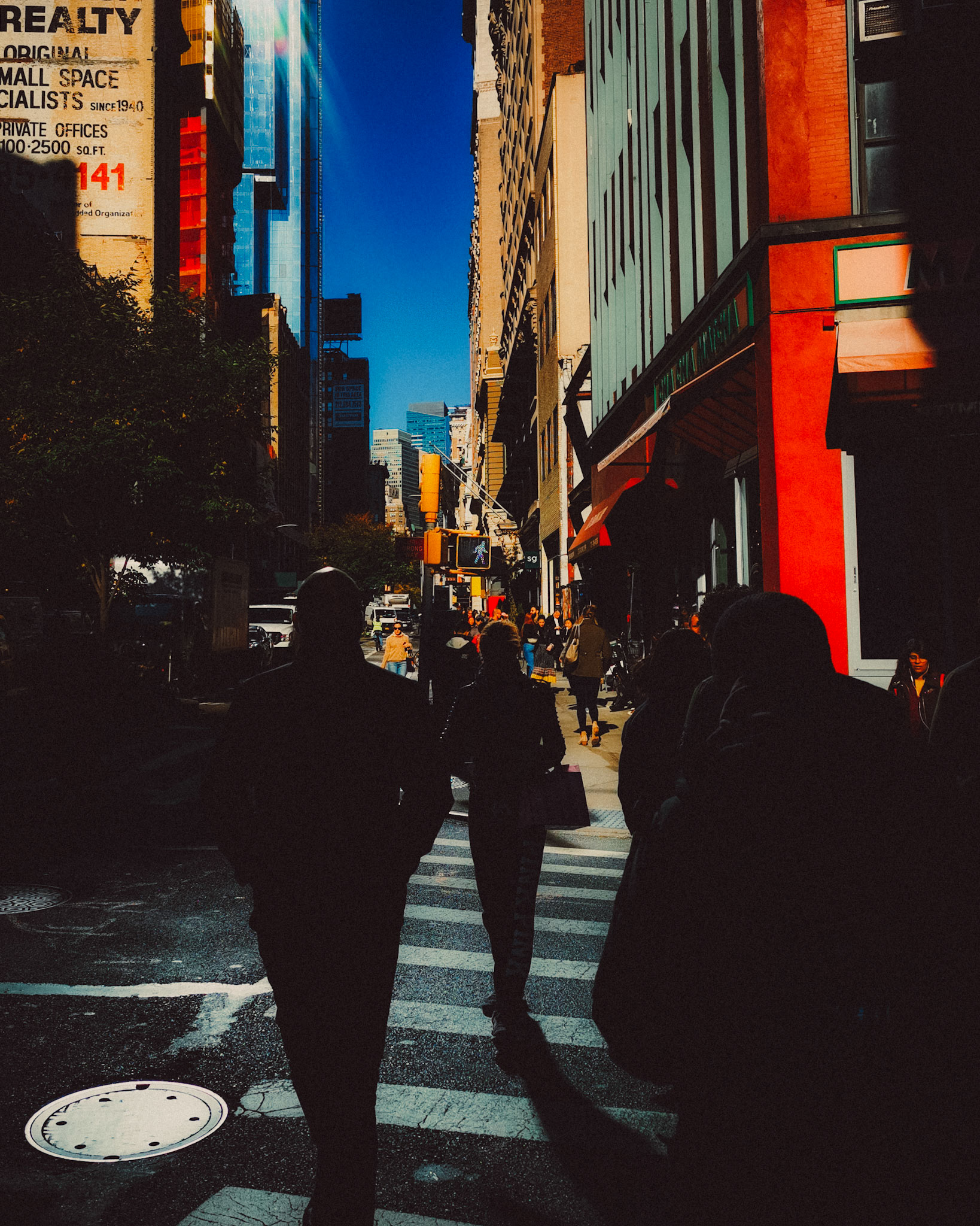 A street snapshot of silhousettes in brightly lit NoMad, Manhattan, New York City, USA, November 2019, Huawei P30 Pro.