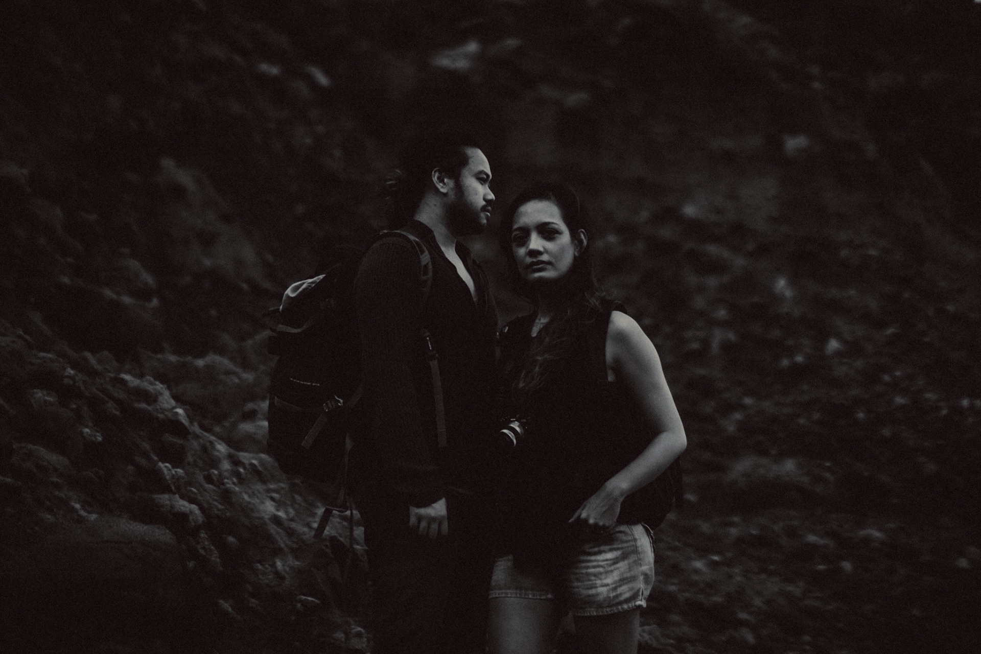 Moody backpacker couple portraits on a rocky cliff below Chawa View Deck in Mahatao, Batanes, Philippines, Southeast Asia, November 2014, Canon EOS 6D.