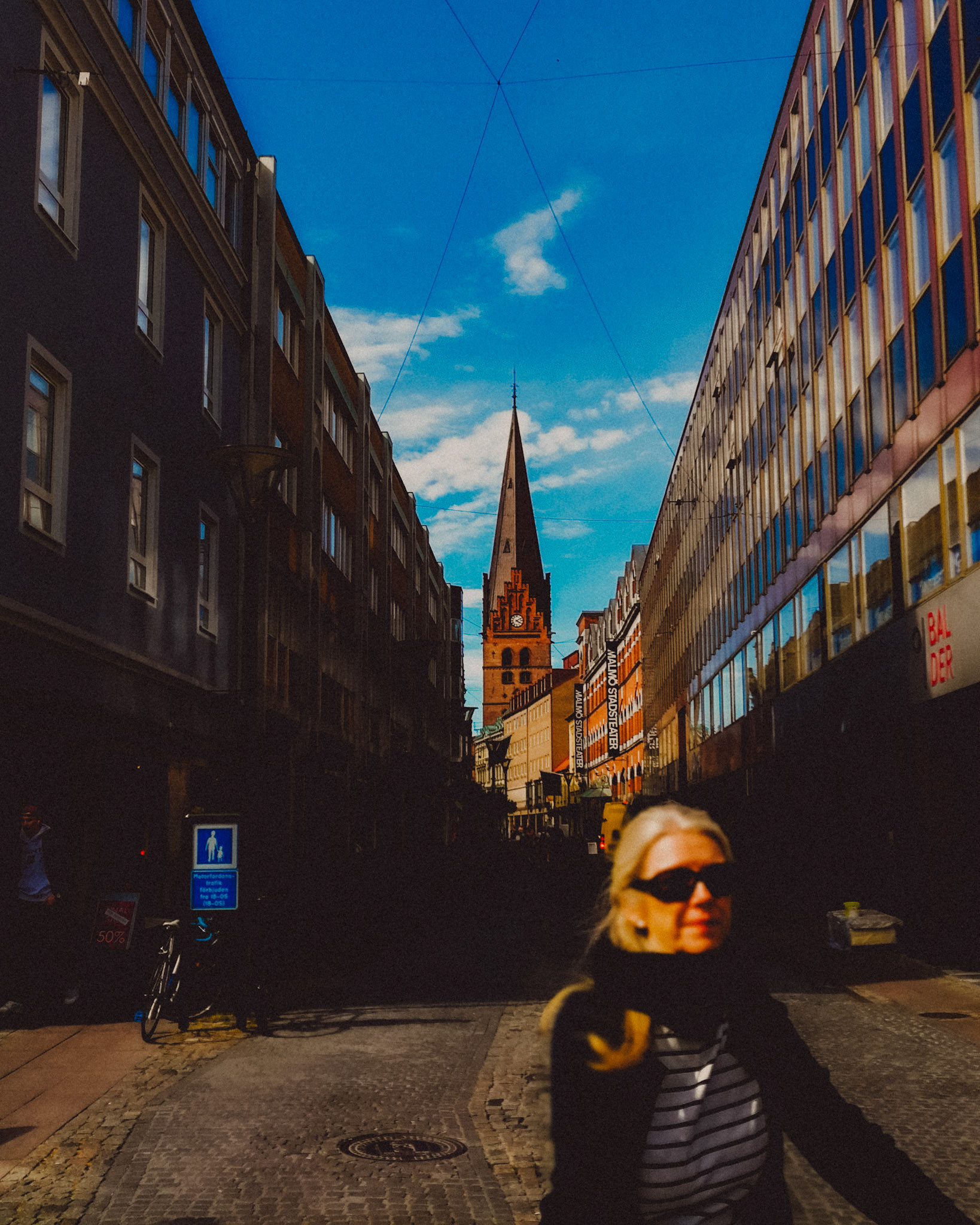 A Swedish woman biking in Gamla staden, Malmö, Sweden, July 2017, Huawei P10 Plus.