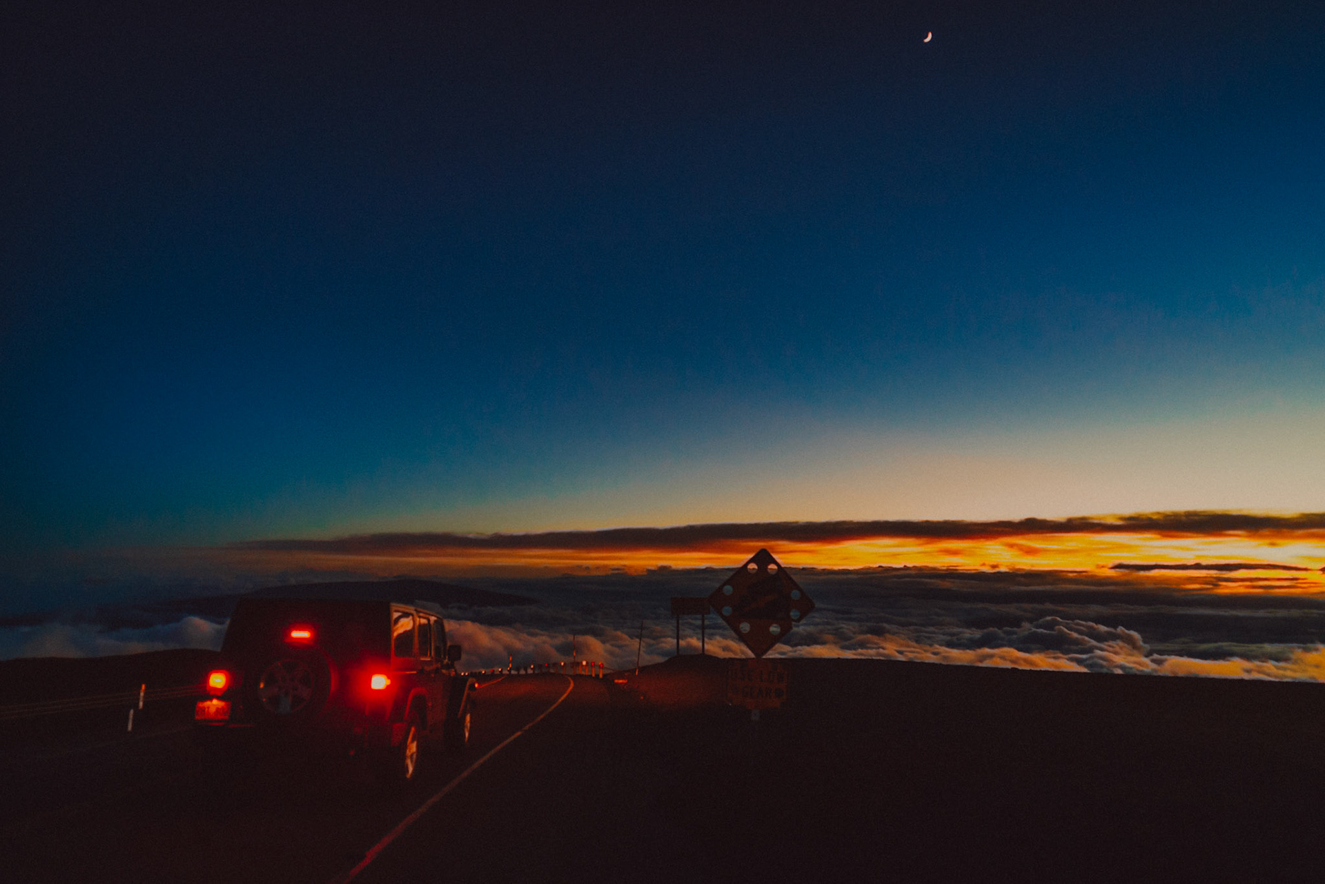 Sunset above the clouds along Mauna Kea Access Road, Mauna Kea Observatories (MKO), Hilo, Hawaii, USA, September 2015, Sony A7S.