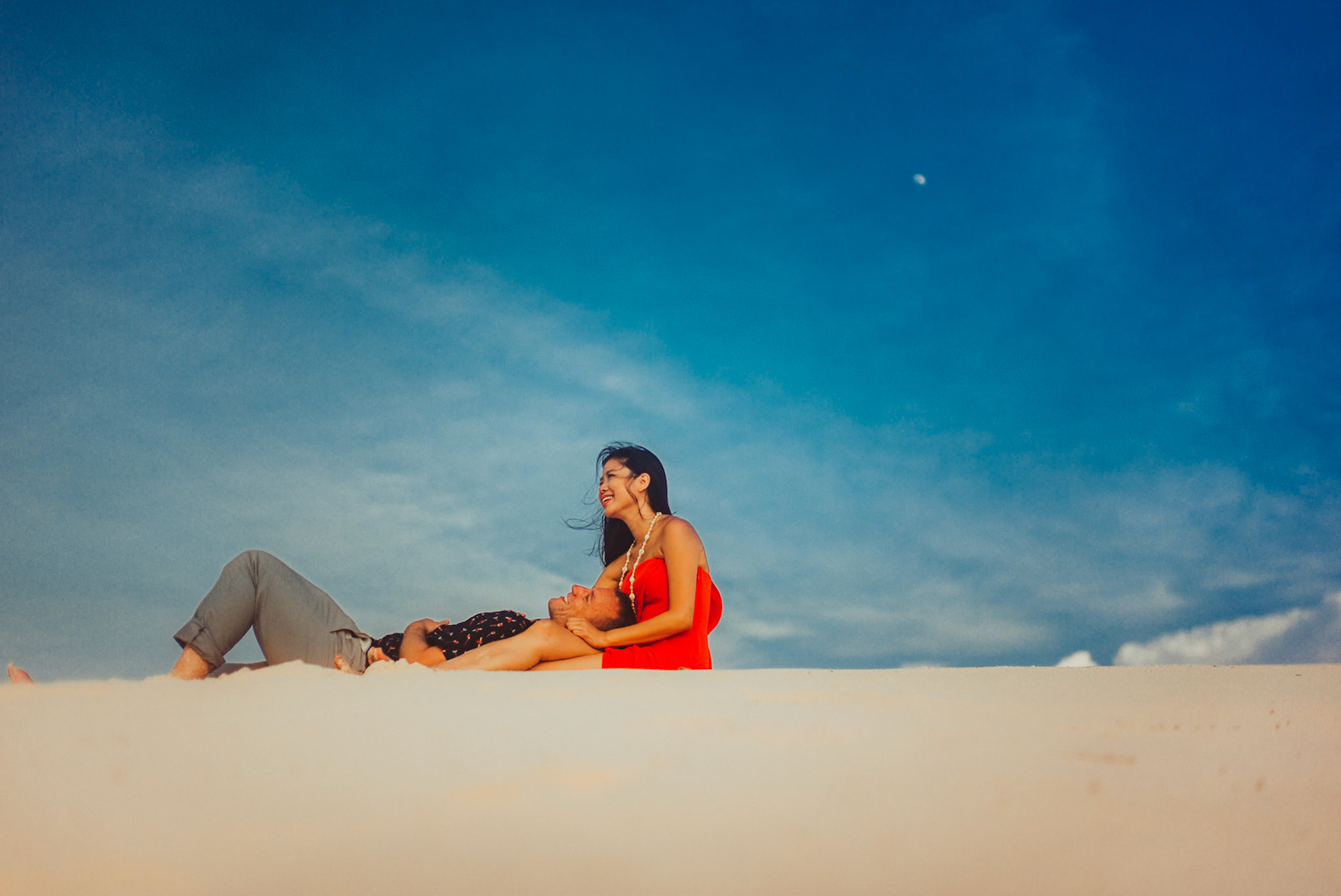 Chill couple portraits on a sand dune, from Renaud and Kat's island hopping adventure session in Malpagalen Island, Club Paradise, Coron, Palawan, Philippines, Southeast Asia, August 2018, Leica M