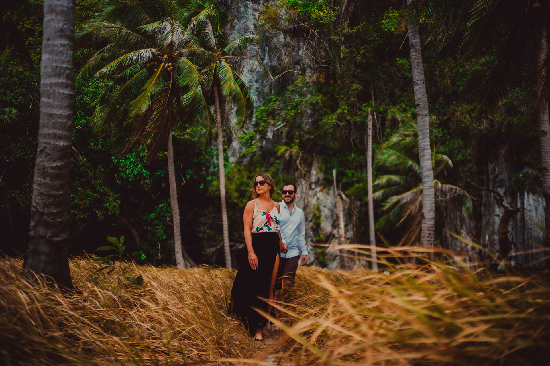 Engagement portraits between coconut trees in Pinagbuyutan Island, El Nido Palawan, Philippines, Southeast Asia, March 2019, Sony A7III.