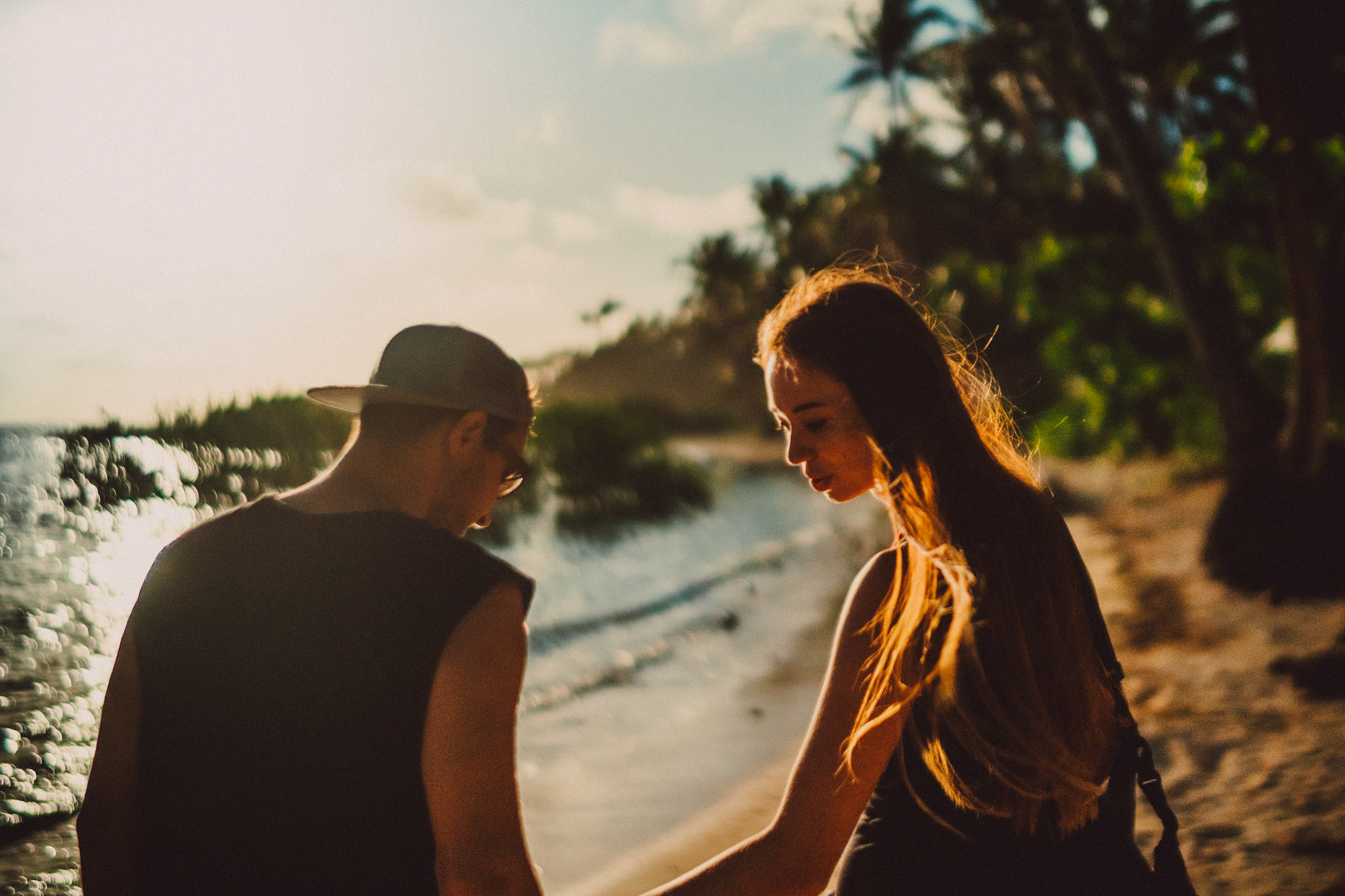 Casual and chill couple portraits on an idyllic tropical beach in Siargao Island, Philippines, Southeast Asia, March 2019, Sony A7III.