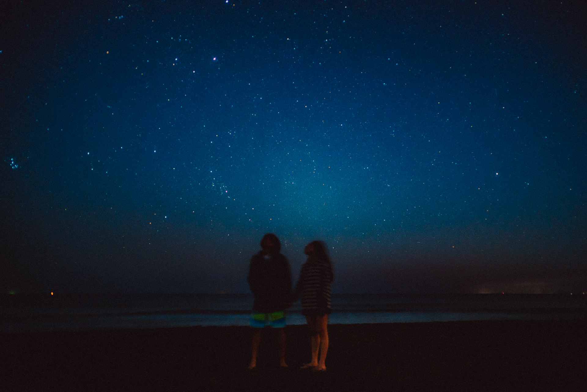 Couple portraits under a starry night sky, from Koke and Pam's chill and outdoorsy prenup photoshoot in Bonuan Beach, Dagupan, Pangasinan, Philippines, Southeast Asia, November 2015, Sony A7S.