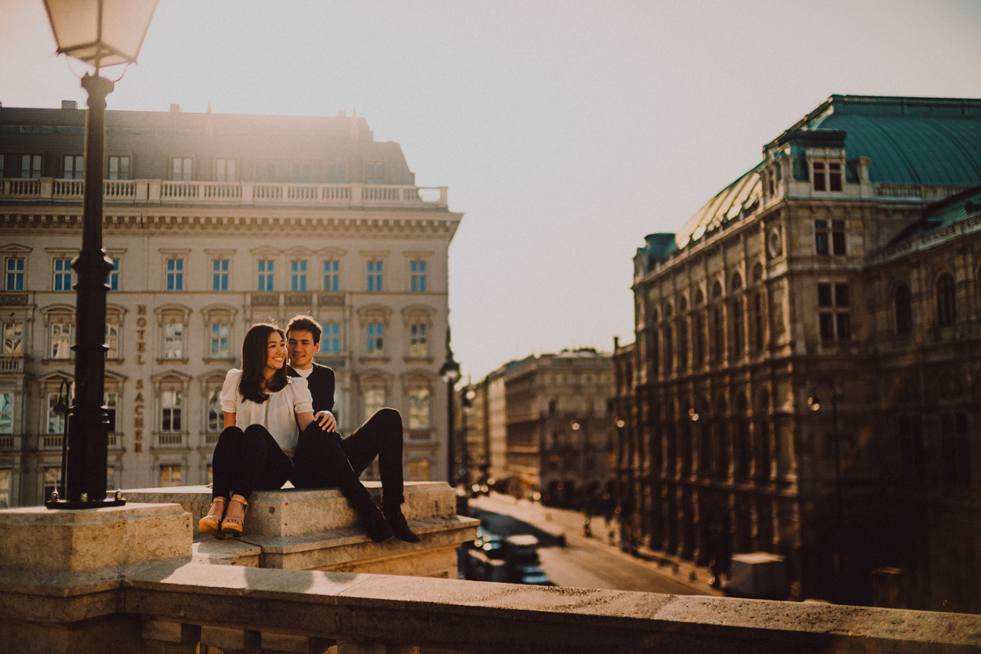 Casual destination engagement photos inspired by "Before Sunrise" movie locations, Albertina Museum with an overlooking view of Philharmoniker Straße and Hotel Sacher in the background, Innere Stadt, Vienna, Austria, August 2017, Sony A7RII.
