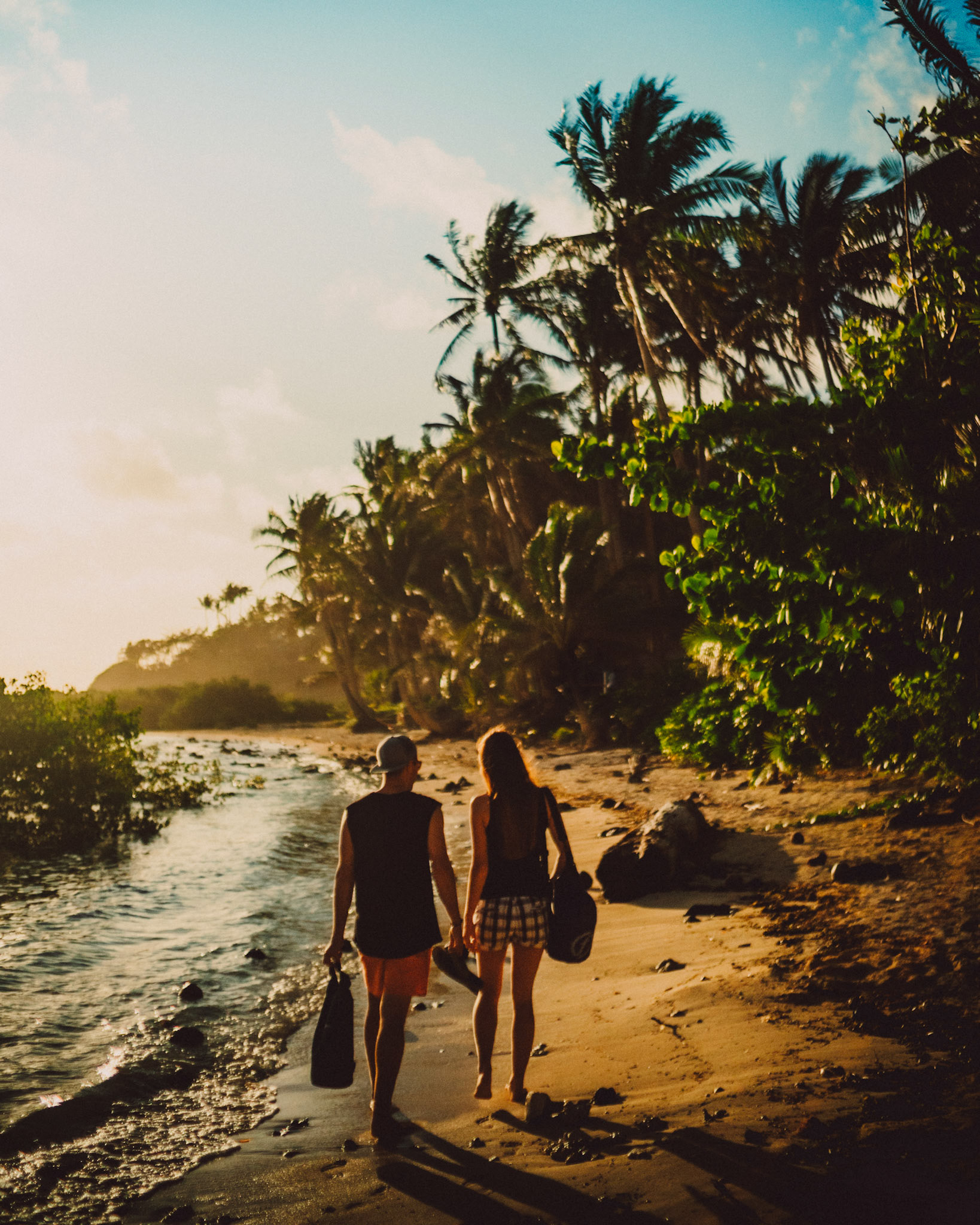 Couple portraits in a wild tropical beach lined with palm trees, Siargao Island, Philippines, Southeast Asia, March 2019, Sony A7III.
