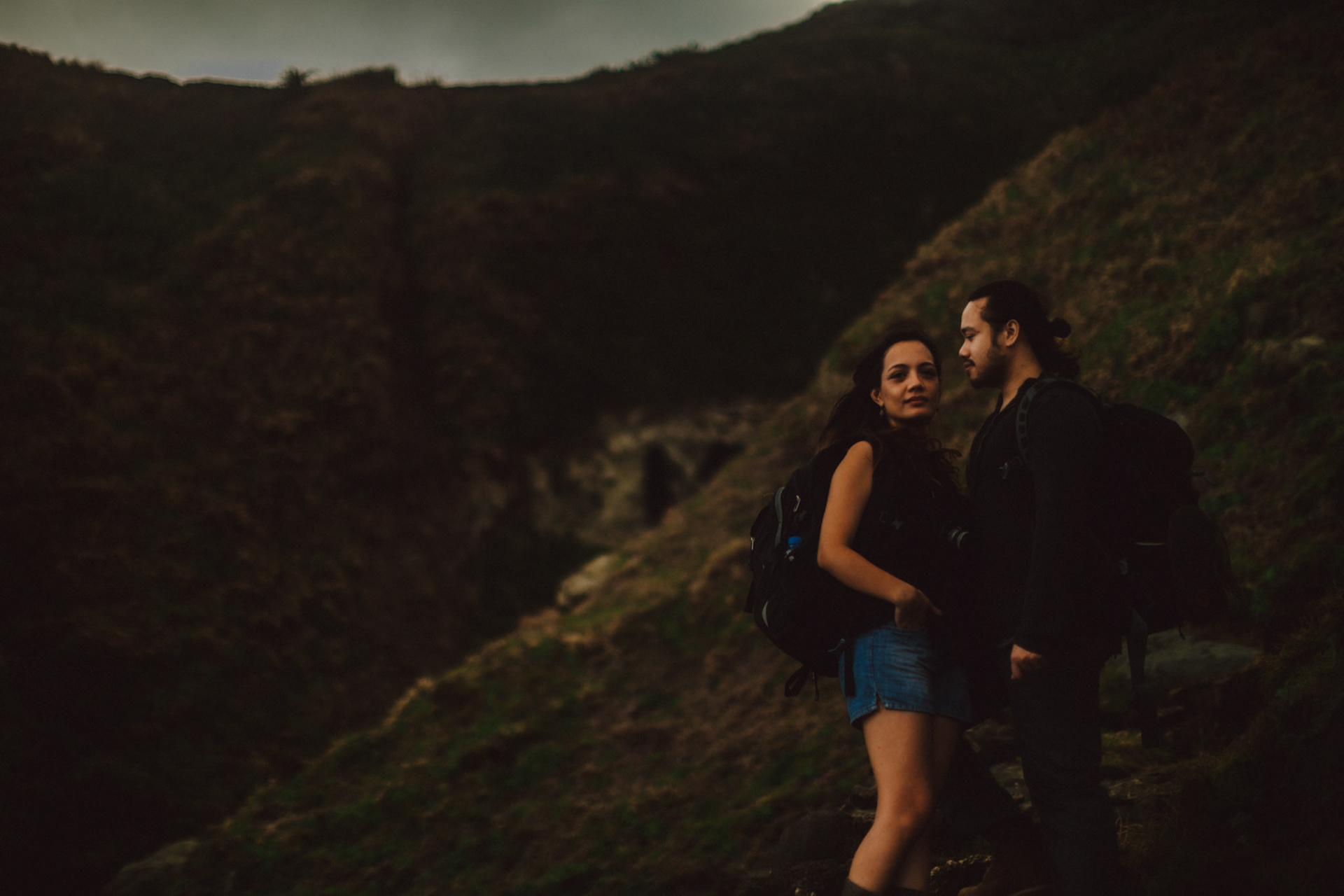 Moody backpacker couple portraits on a cliff below Chawa View Deck in Mahatao, Batanes, Philippines, Southeast Asia, November 2014, Canon EOS 6D.