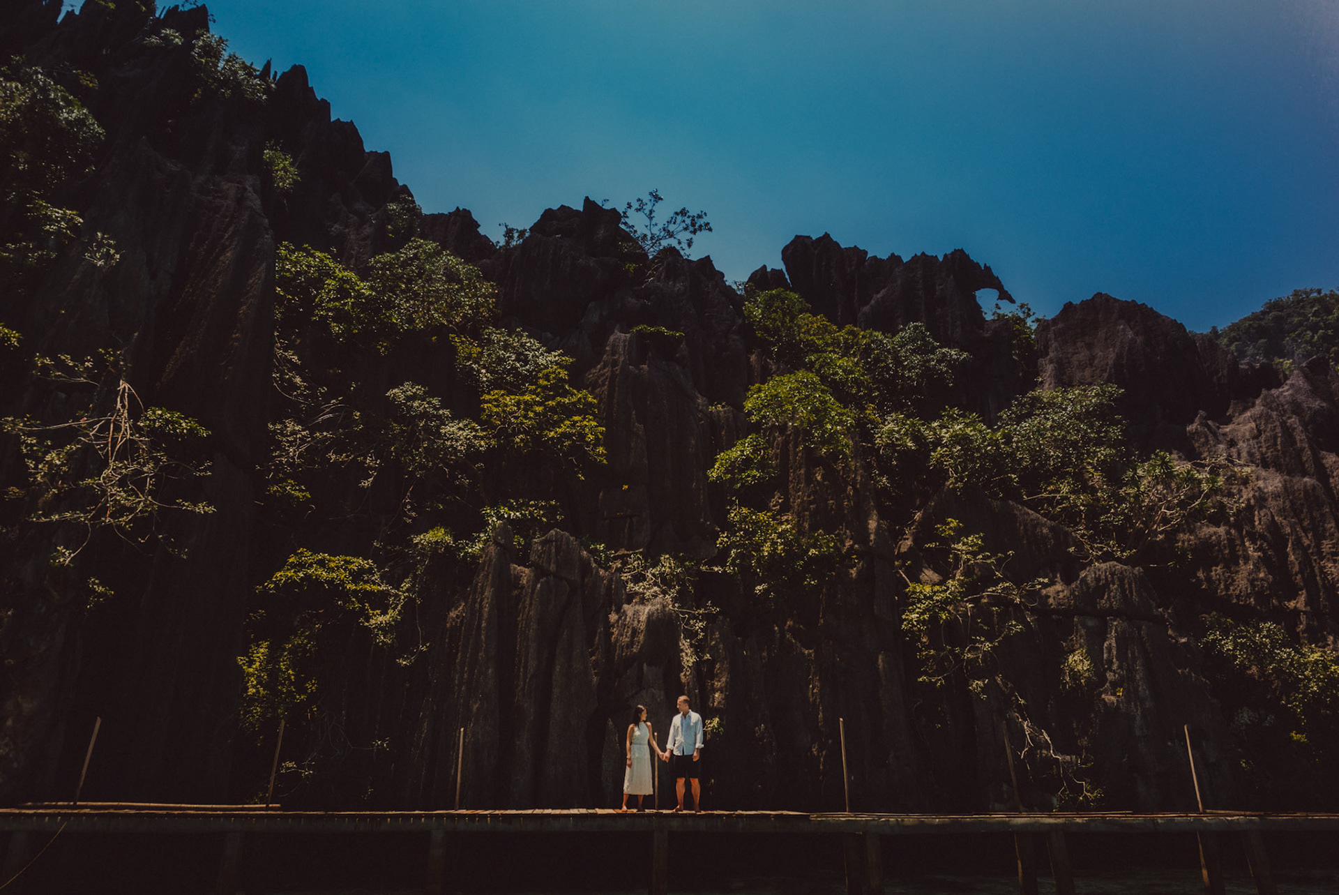 Chill couple photos at the Twin Lagoon's wooden jetty, from Renaud and Kat's island hopping adventure session in Coron, Palawan, Philippines, Southeast Asia, August 2018, Leica M