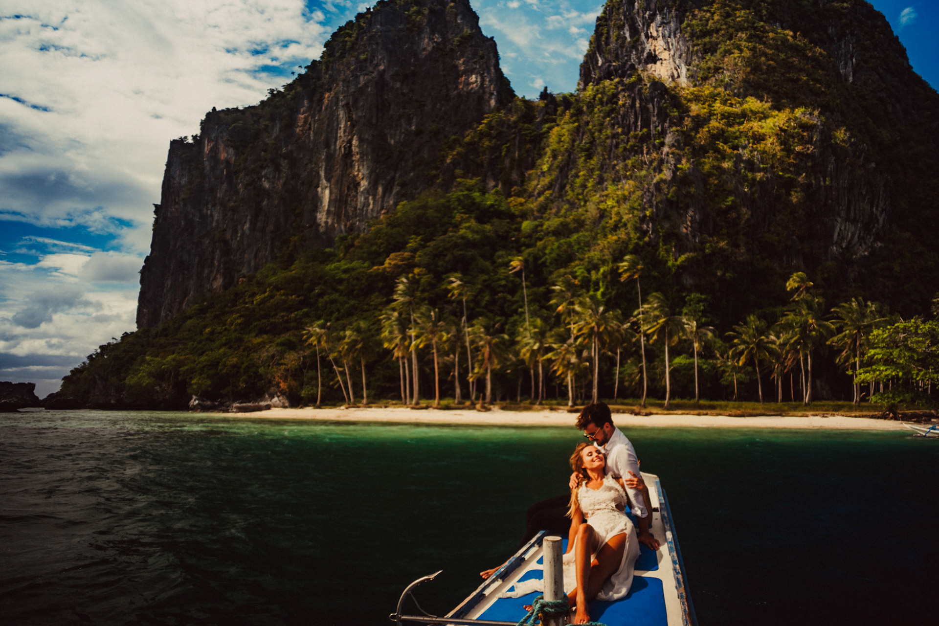 Approaching Pinagbuyutan Island on an outrigger boat, from Johnny and Sylvia's travel couple honeymoon shoot and island hopping tour in El Nido, Palawan, Philippines, Southeast Asia, December 2019, Sony A7III.