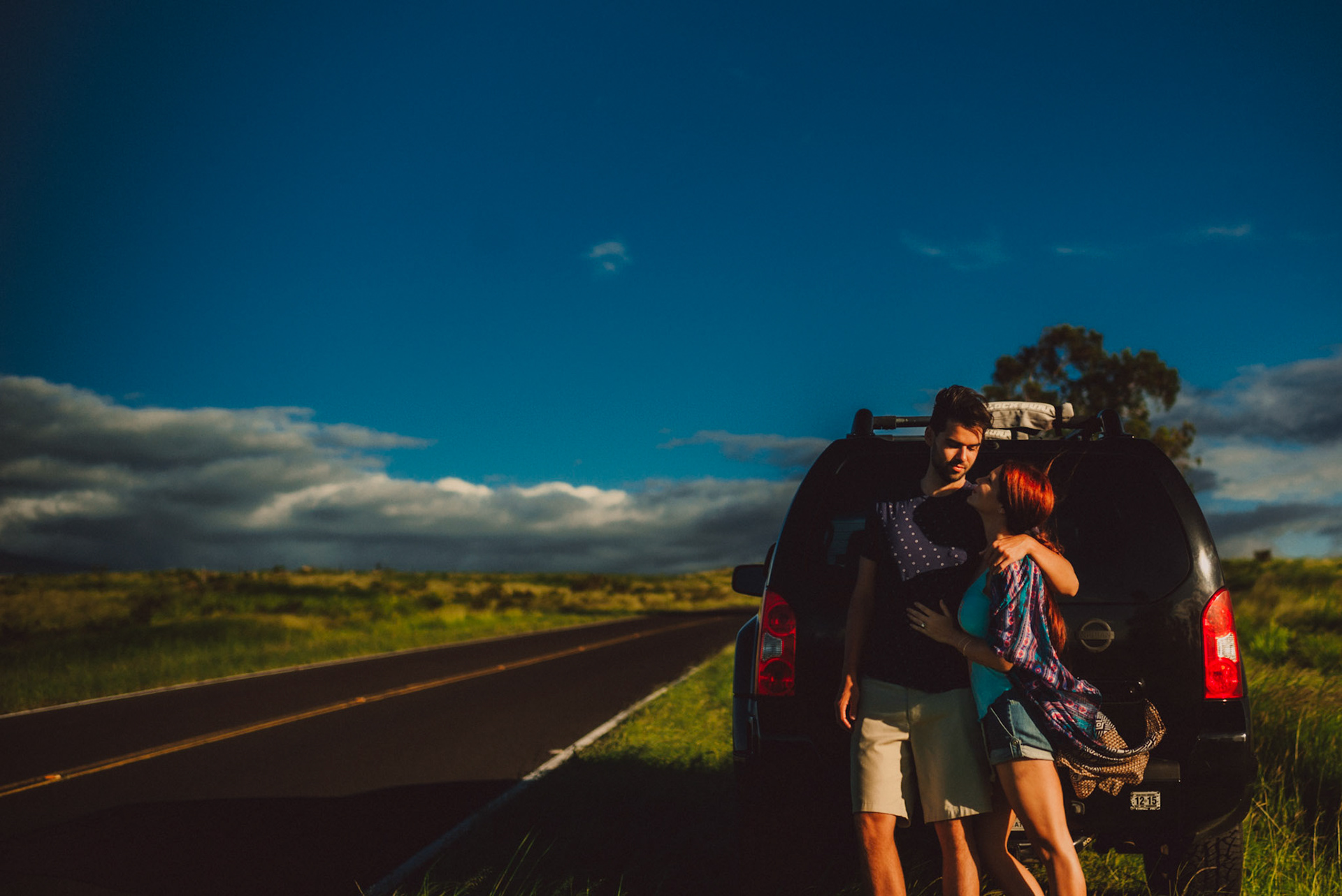 Beside their parked jeep along the highway, from Ryan and Angela's adventure couple shoot in Hawaii, USA, September 2015, Leica M.