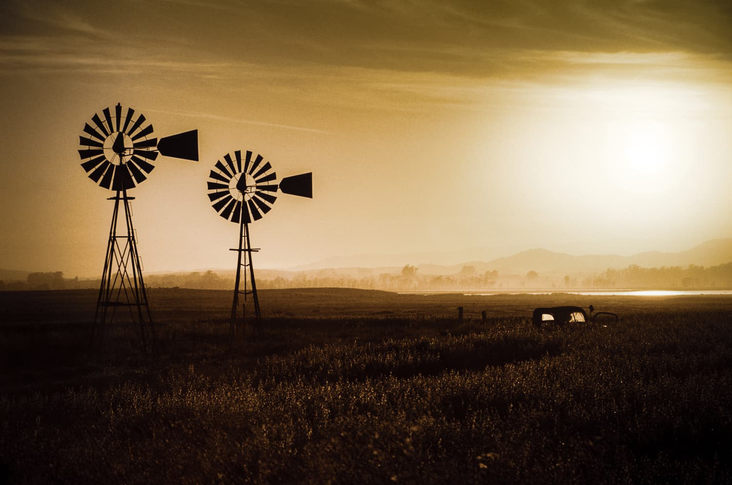 Two Windmills and an old Truck