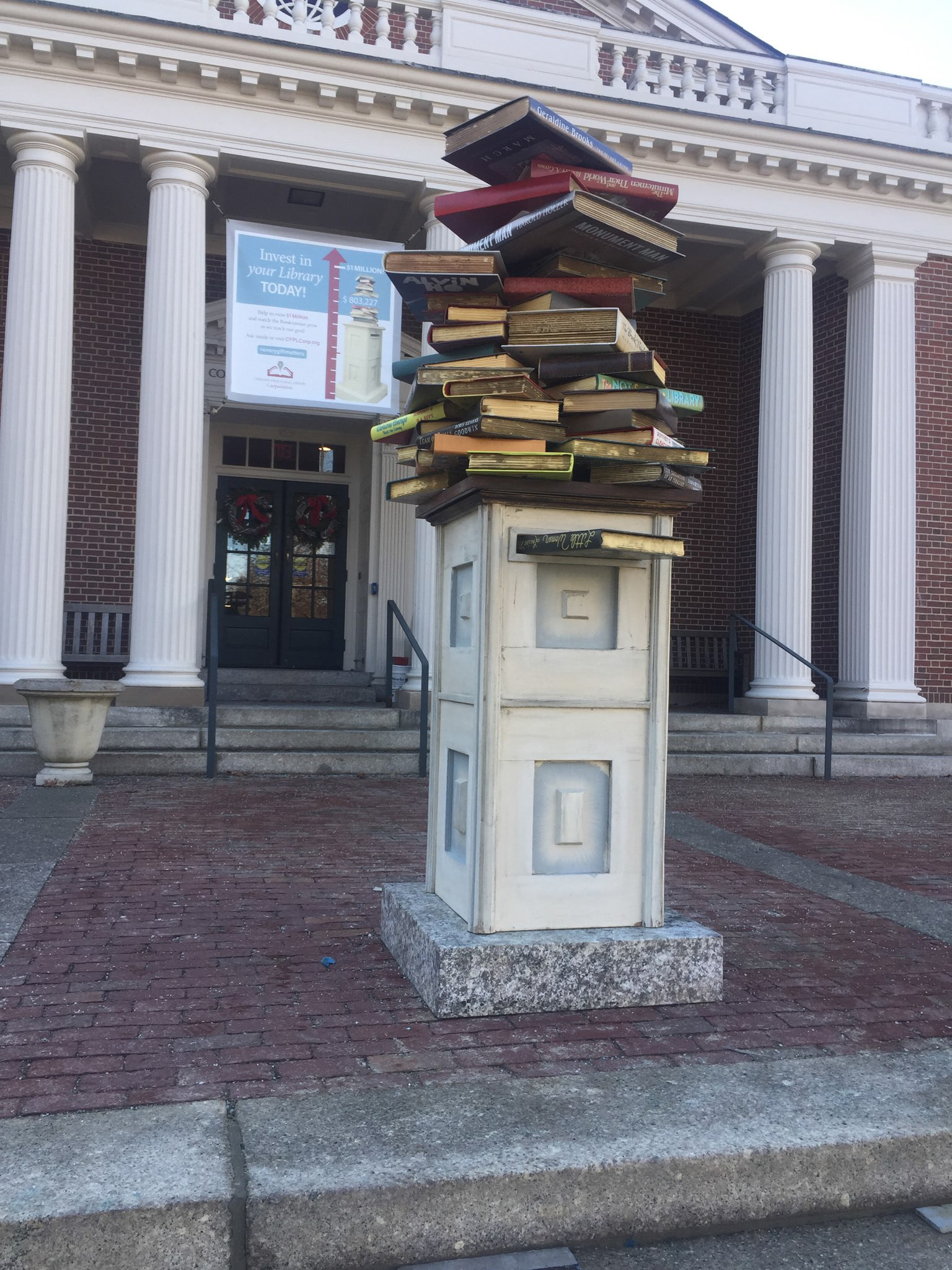 Designed prop book jackets after original Concord authors. As the donations increased we would increase the book stack over a three month period to help reach their goal.