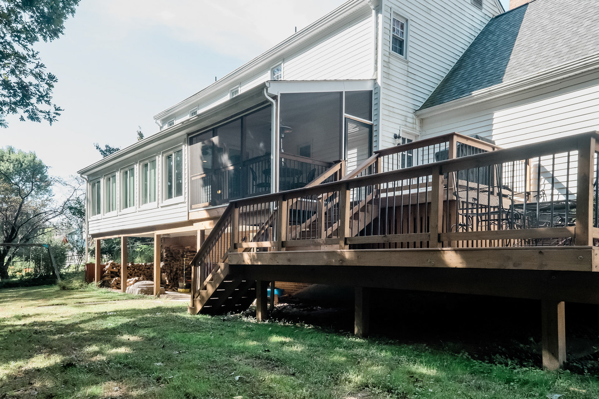 A new two level deck connects the first floor living to the back yard.