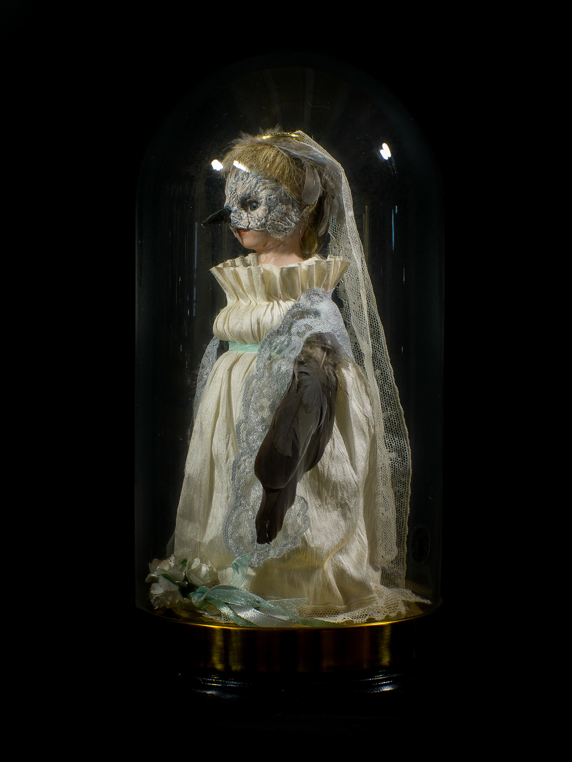 Mistaken Identity - Vintage doll, clay, feathers, silk, glass and brass bell jar on a wooden base. 28 x 15