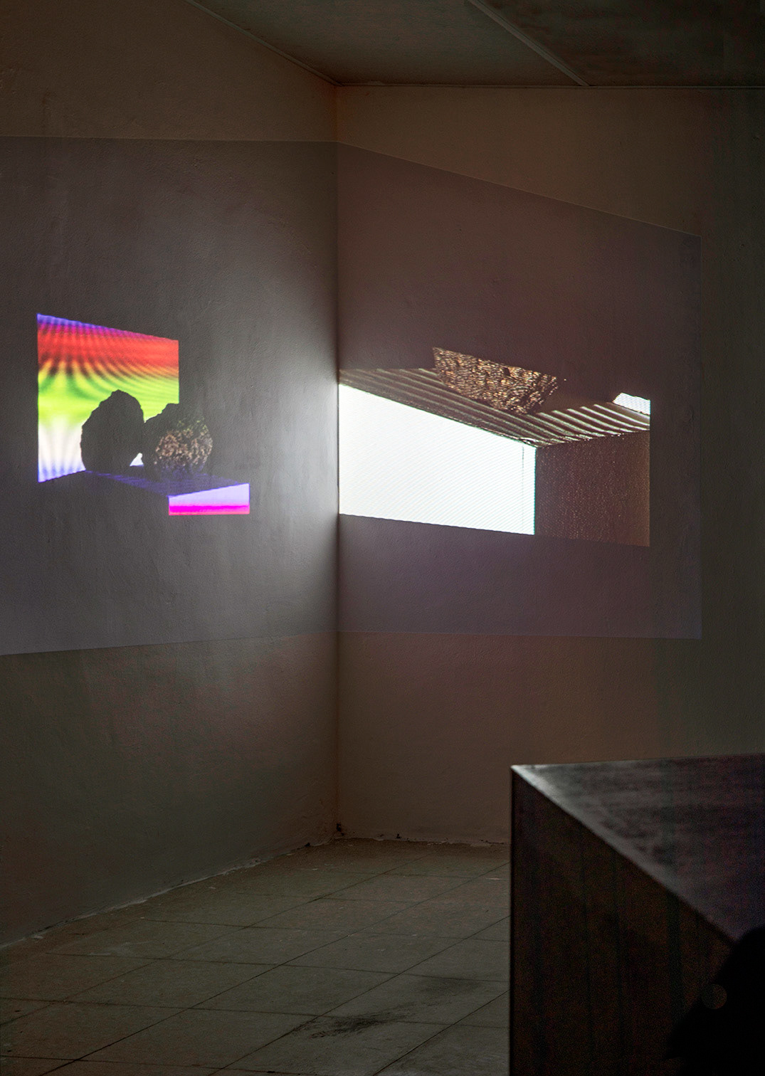 This is not taken, 2019, 1 black box with plywood, tripod, camera shutter: audio, Two-channel video projection on corner wall, 02:09 mins. loop