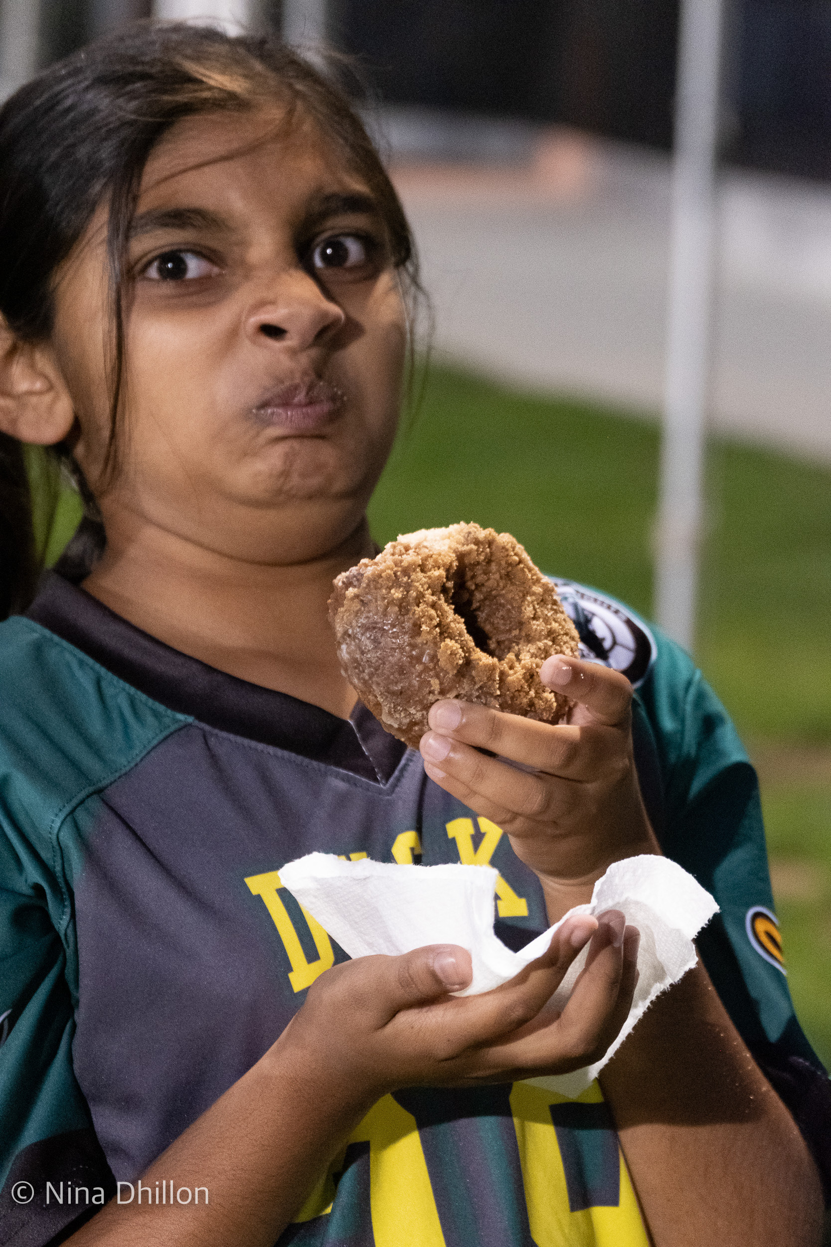 It's all worth it for donuts & funny faces. San Diego, CA. By NinaD. ISO 8000 f/5.6 1/30sec 100mm.