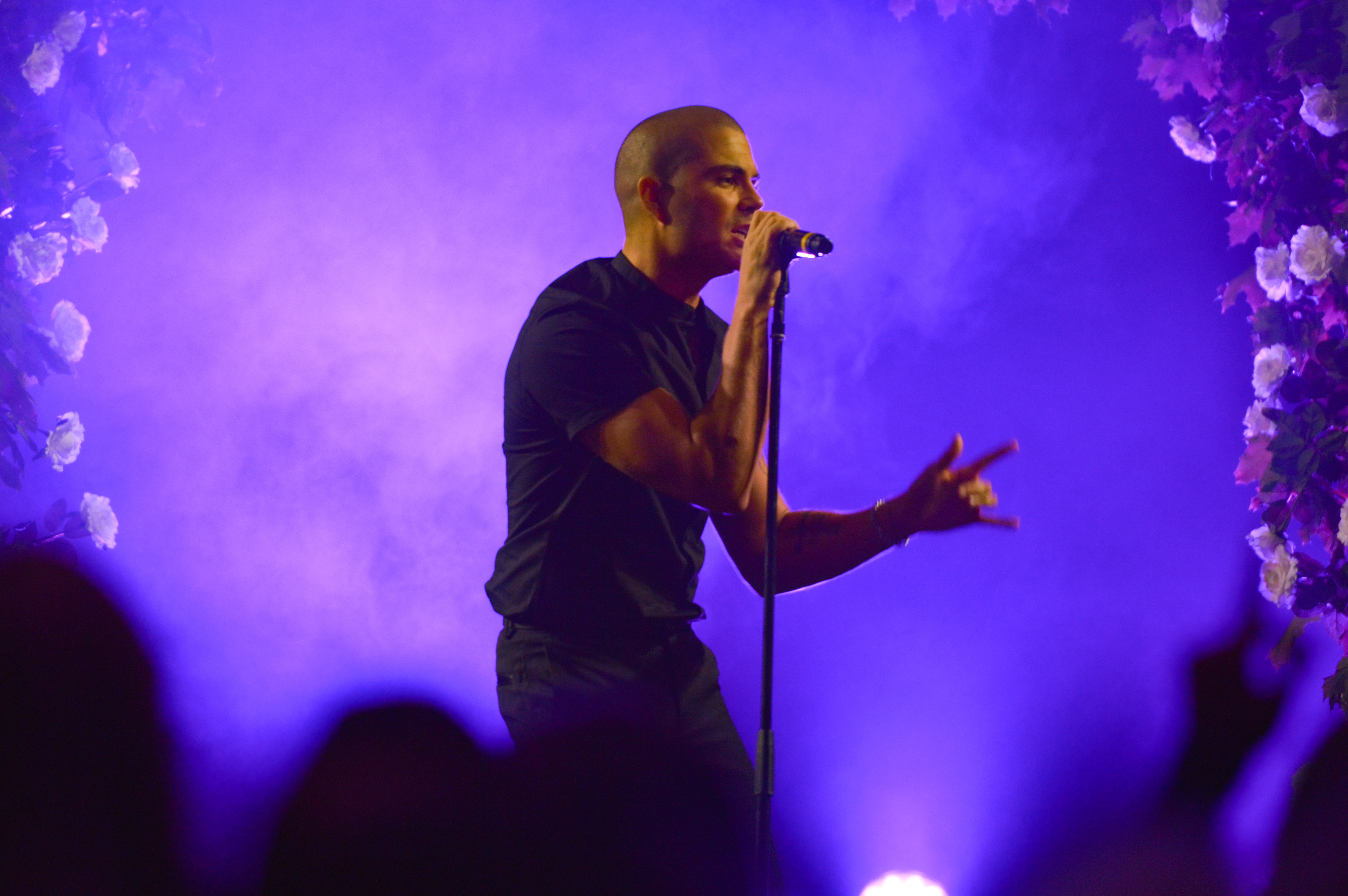 Max George from The Wanted singing on stage at the 2019 Manchester Fashion Festival - runway fashion photographer