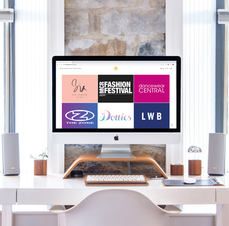 lindsey l ahmet graphic design homepage banner image of a mac with my portfolio page on the screen