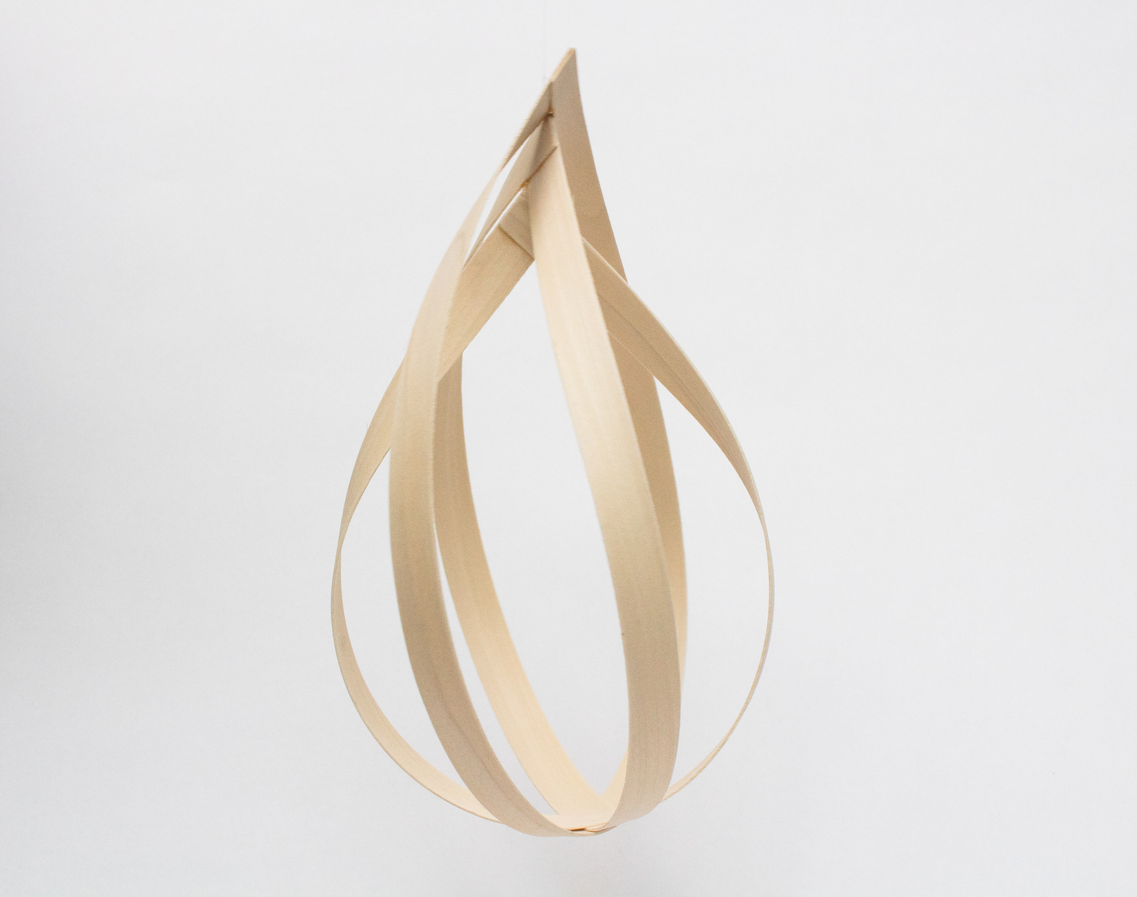 An exploration of volume and form giving through wood veneer strips.