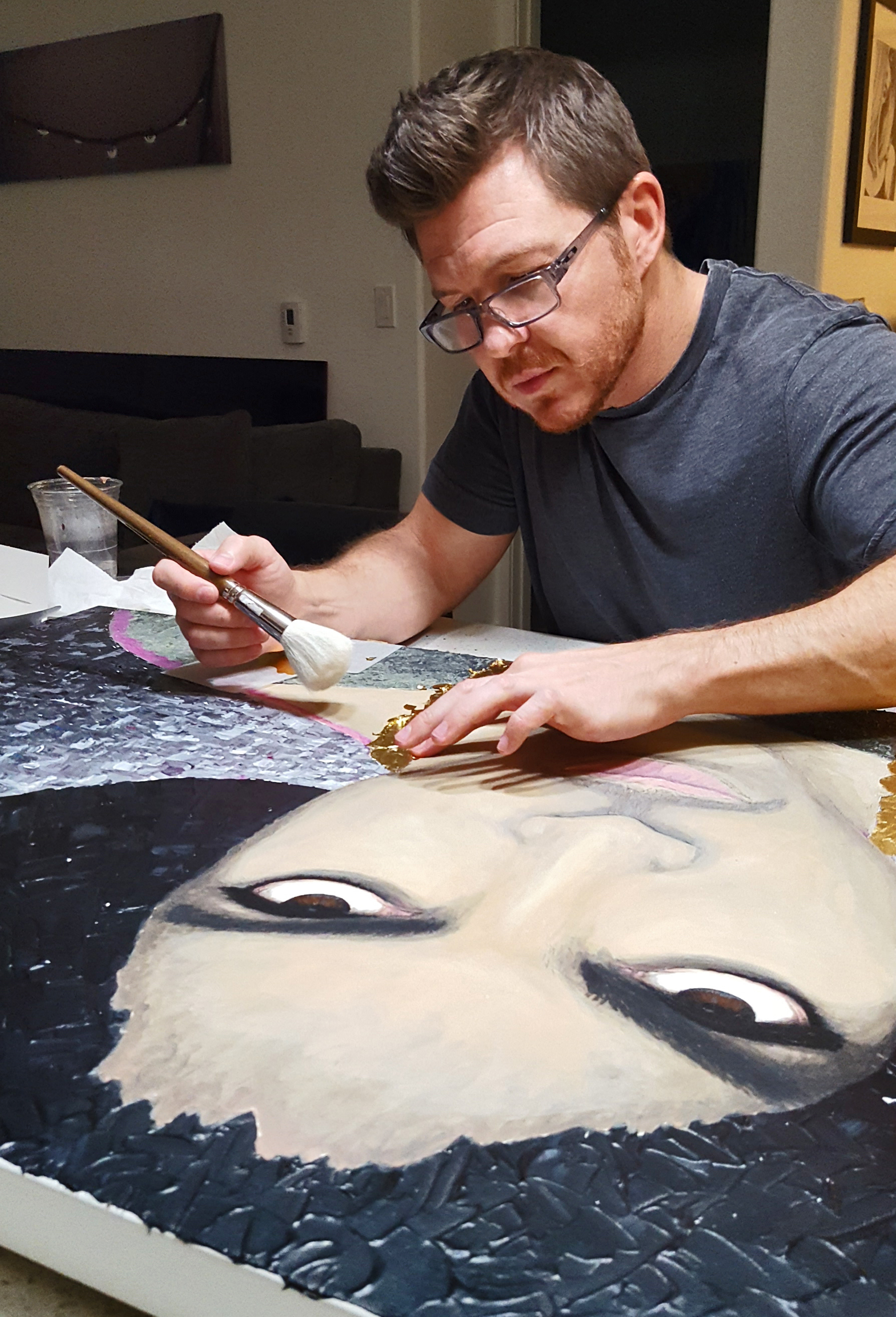 Kent Murnen in the studio working on artwork
