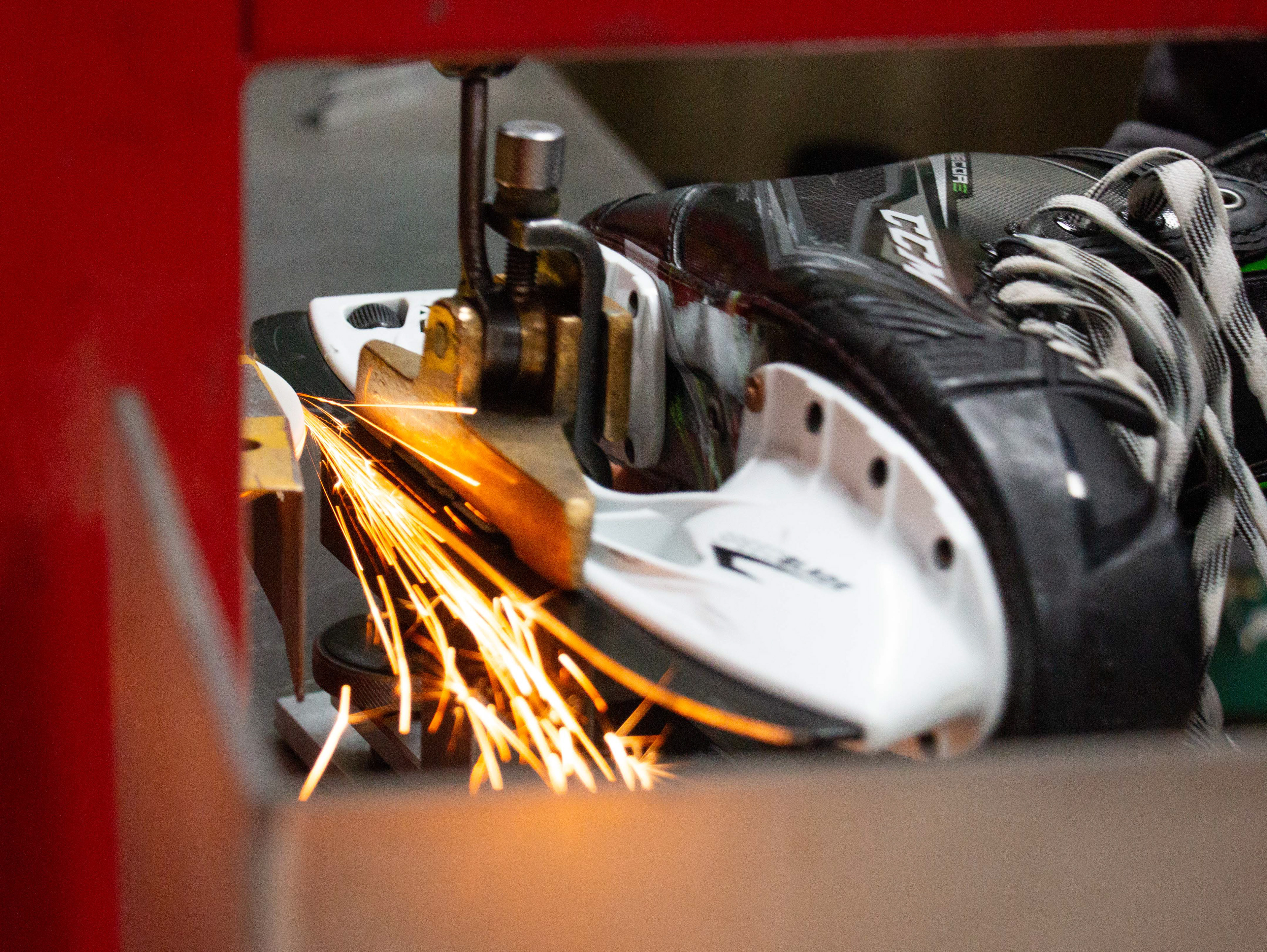 Since I.C.E. Arena reopened on October 12, the workers have been swamped sharpening skates for both figure skaters and hockey players in Mt. Pleasant, Michigan on October 19, 2020. Megan Towler who works in the Pro Shop and sharpens skates said her favorite part of the job is to sharpen skates because she finds it very relaxing.
