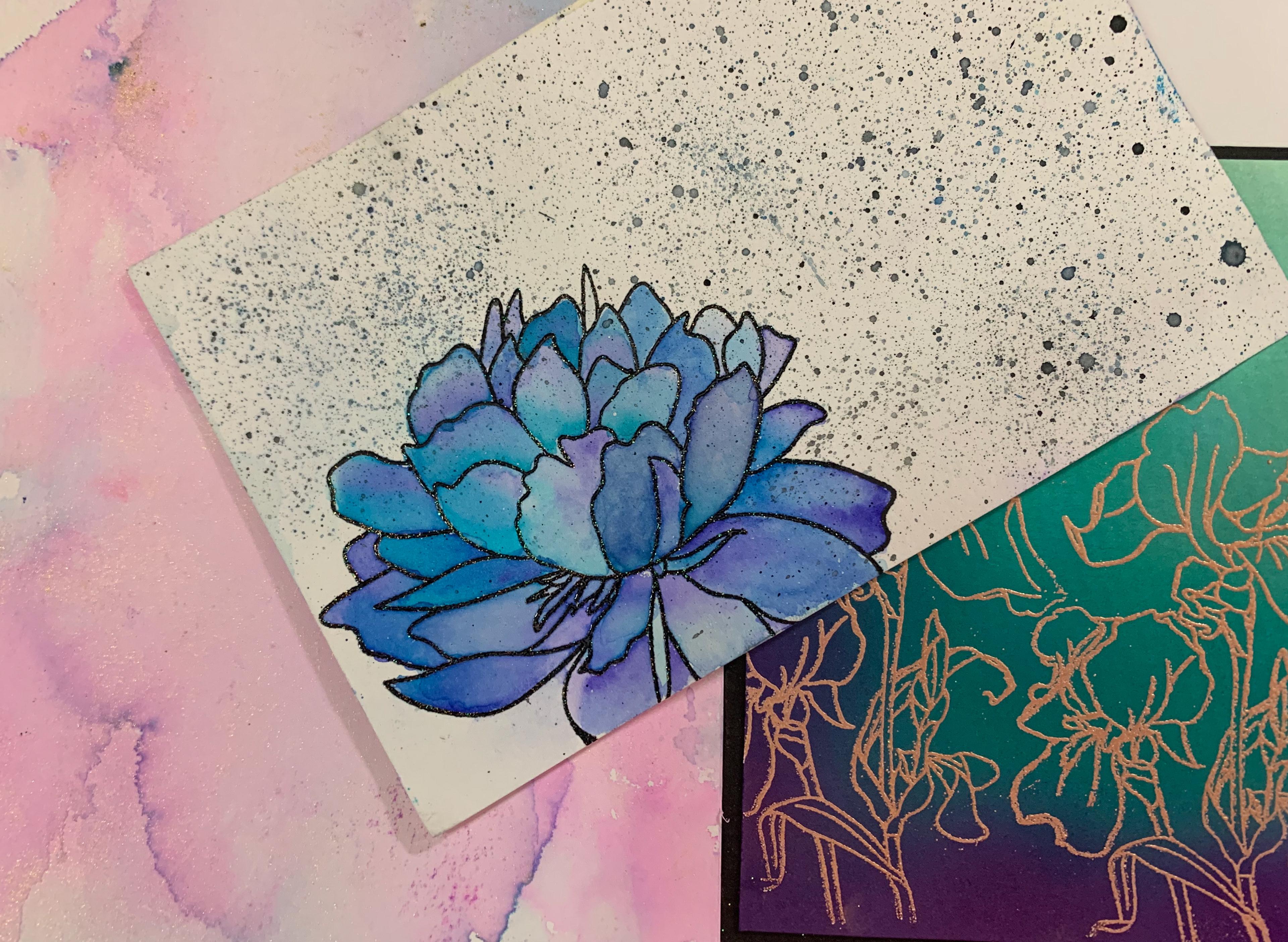Heat embossed and water colored stamp