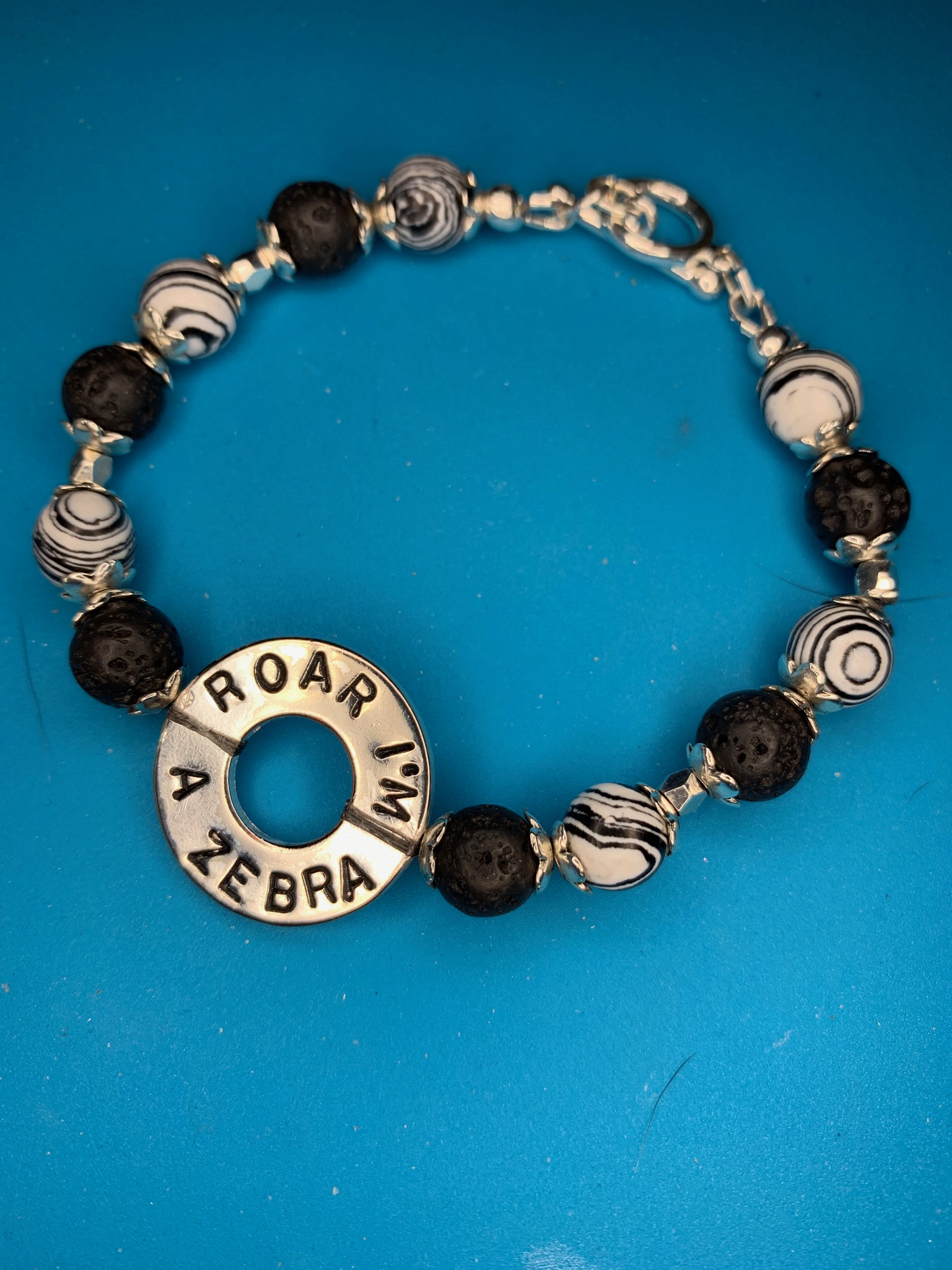 Zebra Malachite, Silver plated accents and clasp and Lava Beads