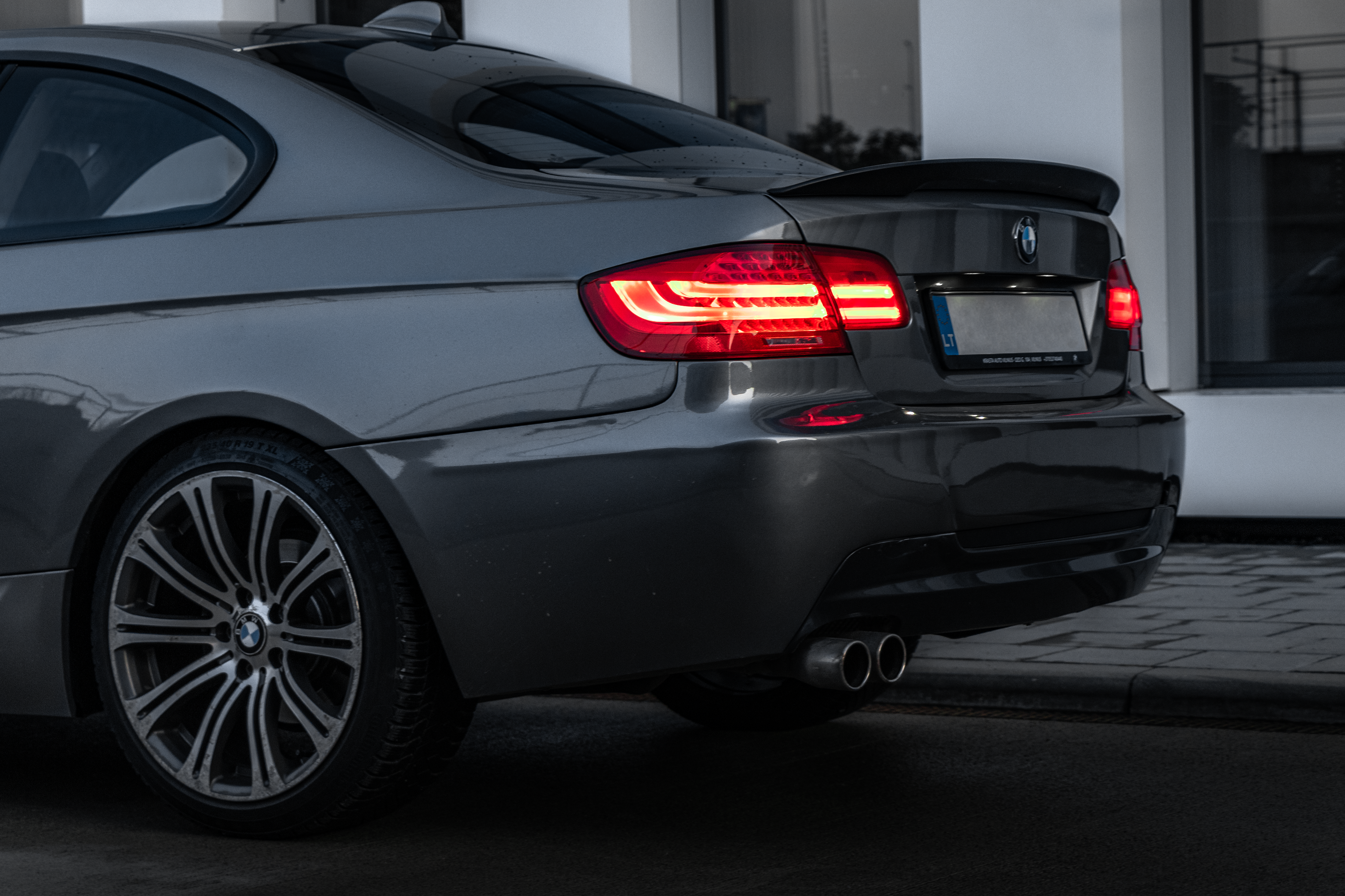A Silver BMW E92 328i in the city car automotive photography