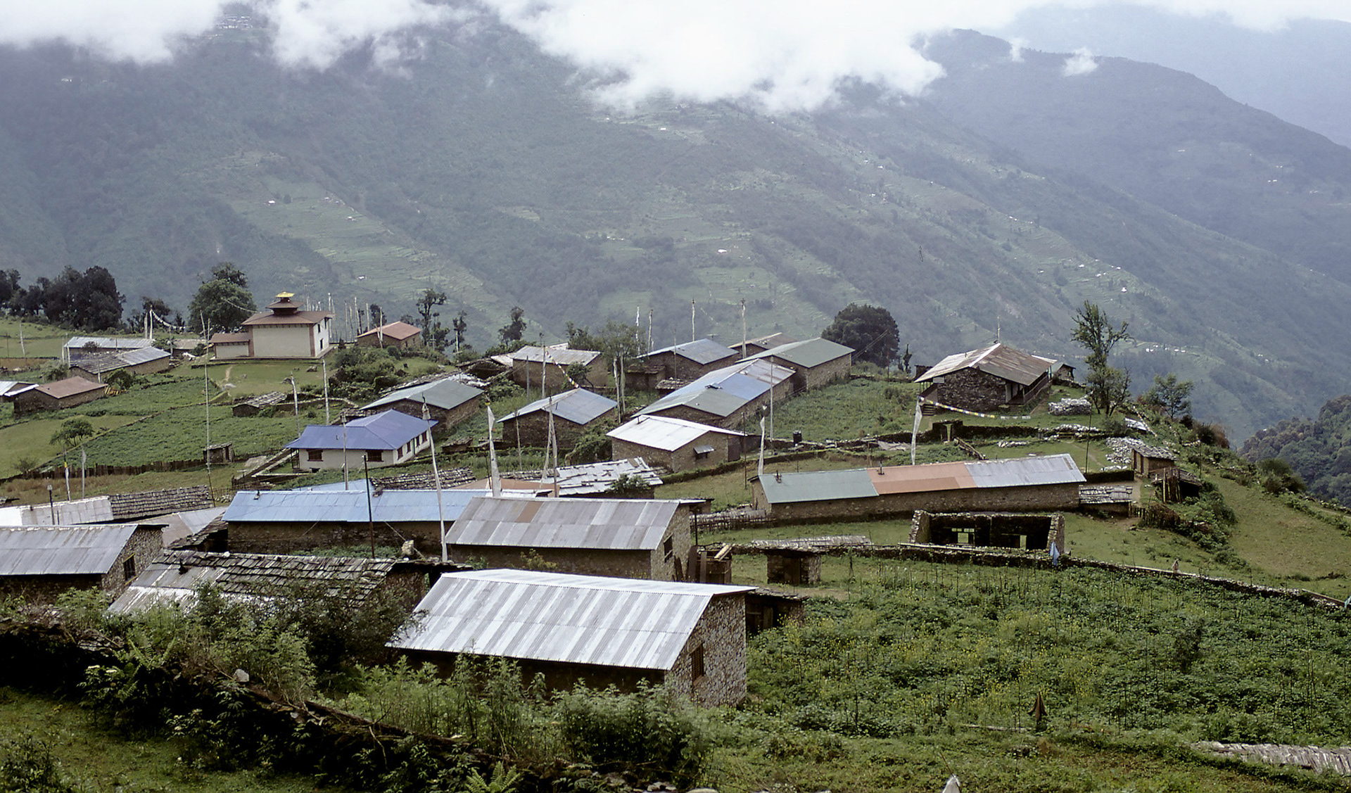 Village gompa (temple) in left foreground; tin roofs are new addition.