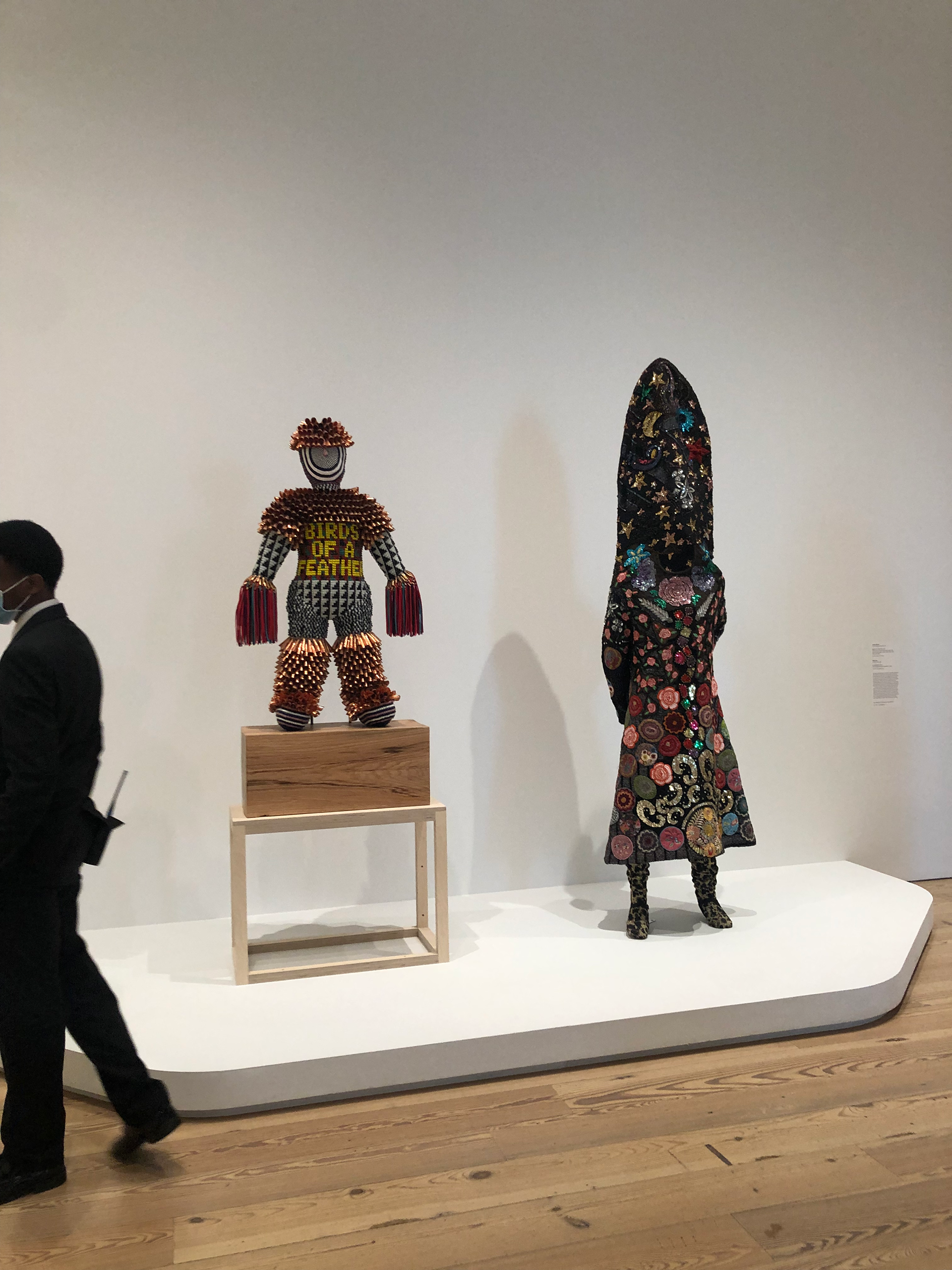 Jeffrey Gibson, BIRDS OF A FEATHER, 2017; Nick Cave, Sound Suit #20, 2005