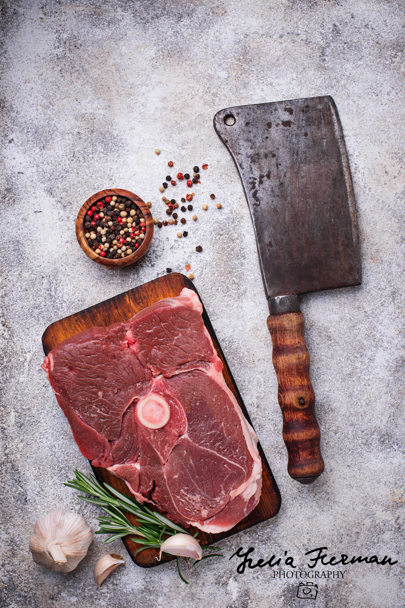 Lamb meat with rosemary, spices and cleaver. Top view