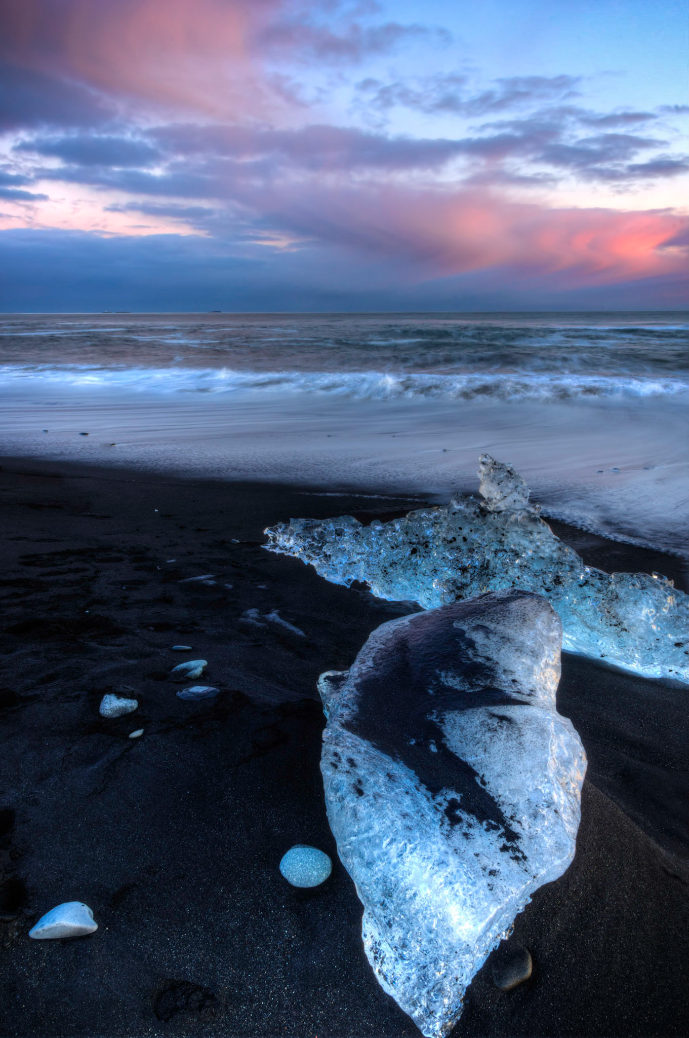 Sunset at black sand beach outside of Jökulsárlón.Austurland, IcelandFebruary 9, 2016This is an HDR image consisting of 5 exposures merged in Photomatix Pro. Additional processing in Lightroom and Photoshop.PENTAX K-3, Sigma 18-250mm f/3.5-6.3 DC OS HSMISO 100 18 mm  2.5 sec at ƒ / 22