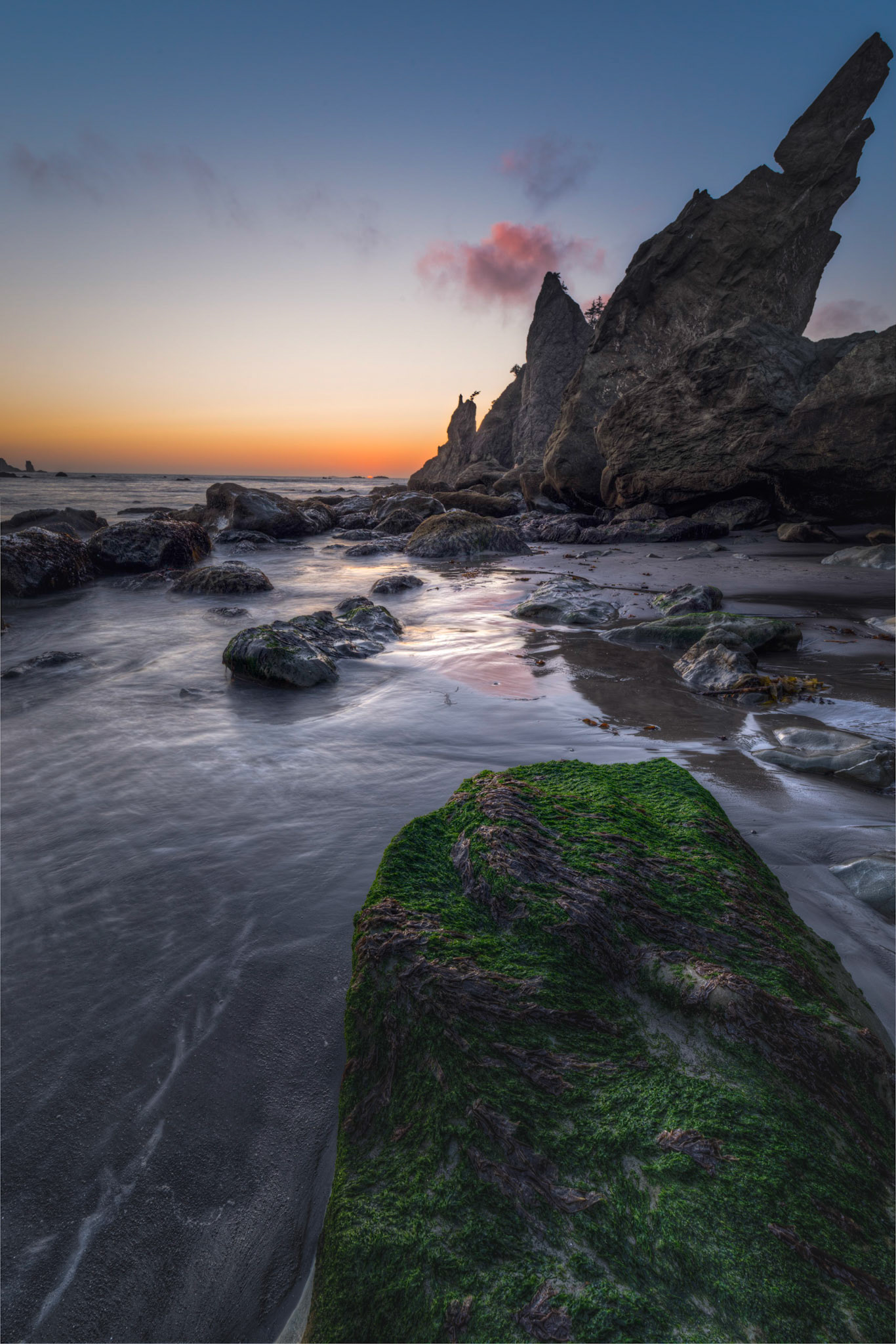 The last seconds before the limb of the sun sinks below the horizon.Olympic National ParkWashingtonAugust 4, 2016This is an HDR image consisting of 10 exposures merged in Photomatix Pro. Additional processing in Lightroom and Photoshop.PENTAX K-1, HD PENTAX-D FA 15-30mm F2.8ED SDM WRISO 100 15 mm  ⅕ sec at ƒ / 22