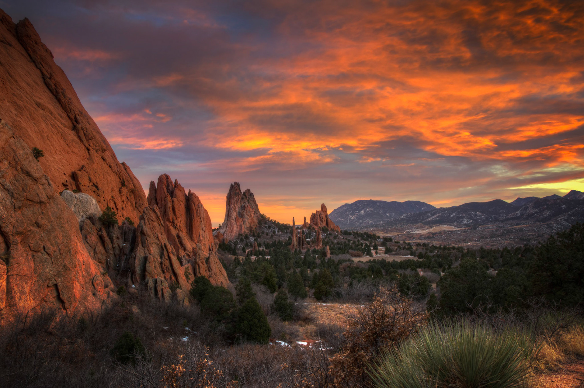 Sunset over Garden of the Gods and Cheyenne Mountain.Colorado Springs, ColoradoDecember 7, 2015This is an HDR image consisting of 5 exposures merged in Photomatix Pro. Additional processing in Lightroom and Photoshop.PENTAX K-3, Sigma 18-250mm f/3.5-6.3 DC OS HSMISO 100 18 mm  0.3 sec at ƒ / 11