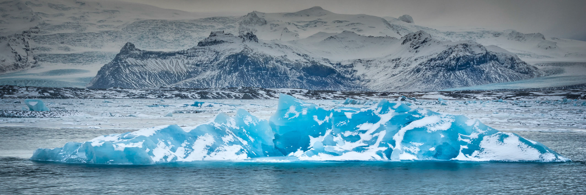 A large chunk of ice from the Vatnajökull Glacier floating and melting in Jökulsárlón.JökulsárlónAusturland, IcelandFebruary 1, 2016This is an HDR image consisting of 5 exposures merged in Photomatix Pro. Additional processing in Lightroom and Photoshop.PENTAX K-3, Sigma 18-250mm f/3.5-6.3 DC OS HSMISO 100 37 mm  0.3 sec at ƒ / 11