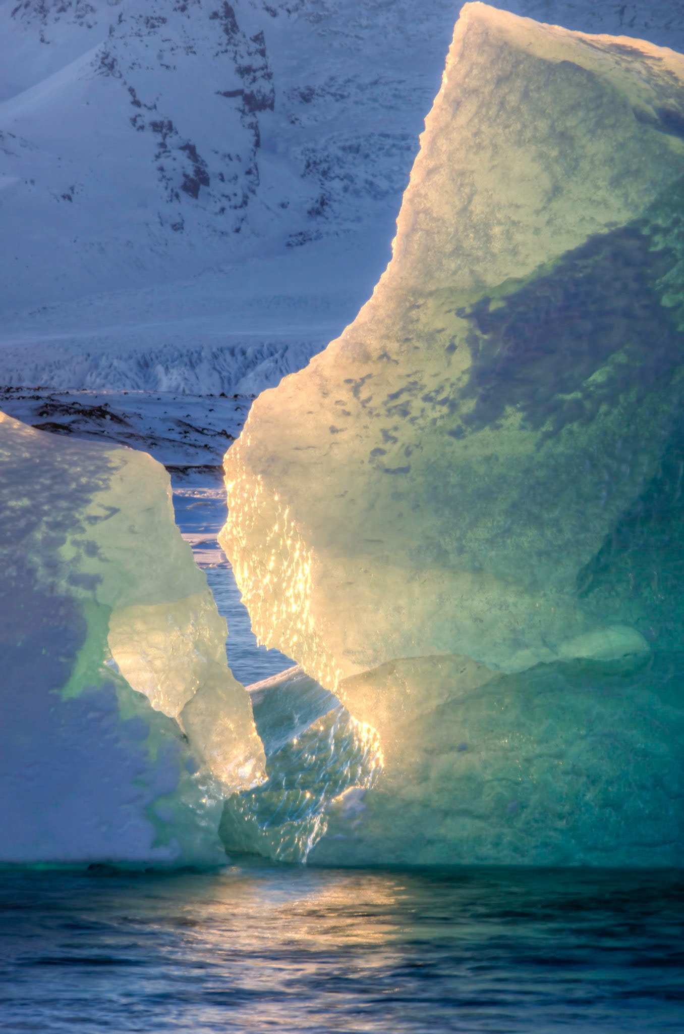 Icebergs from the Vatnajökull glacier floating in Jökulsárlón.JökulsárlónAusturland, IcelandFebruary 9, 2016This is an HDR image consisting of 5 exposures merged in Photomatix Pro. Additional processing in Lightroom and Photoshop.PENTAX K-3, Sigma 18-250mm f/3.5-6.3 DC OS HSMISO 100 210 mm  ⅛ sec at ƒ / 18