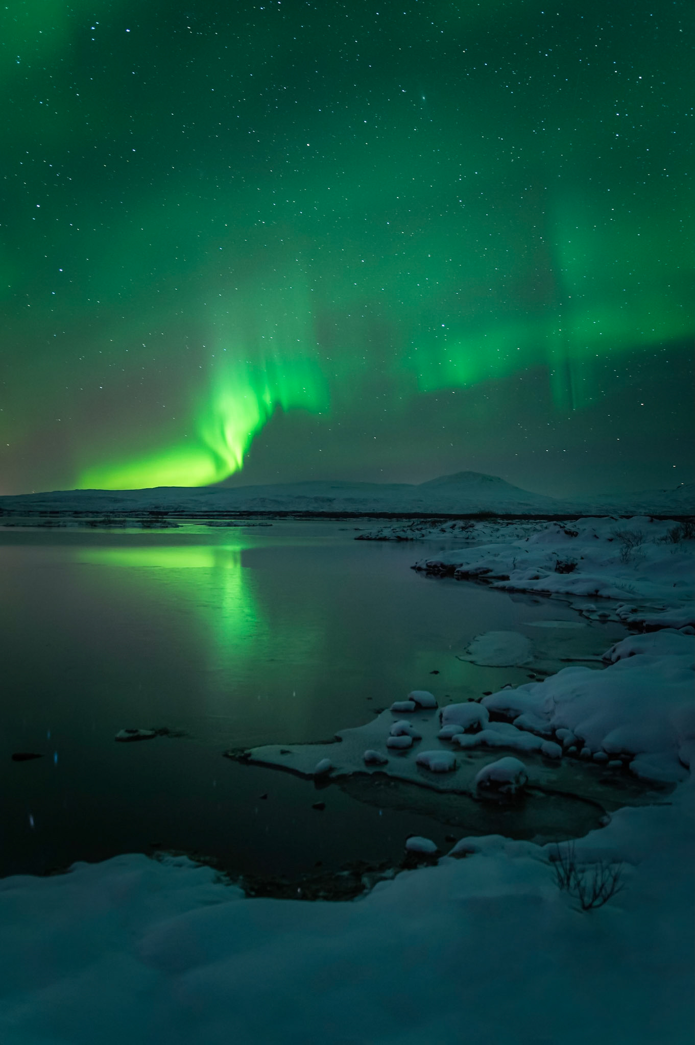 The Aurora Borealis, over Þingvallavatn.Þjóðgarðurinn á ÞingvöllumSuðerland, IcelandJanuary 31, 2016Pentax K-3, SIGMA 18-35mm F1.8 DC HSM A013ISO 400 18 mm  20.0 sec at ƒ / 1.8