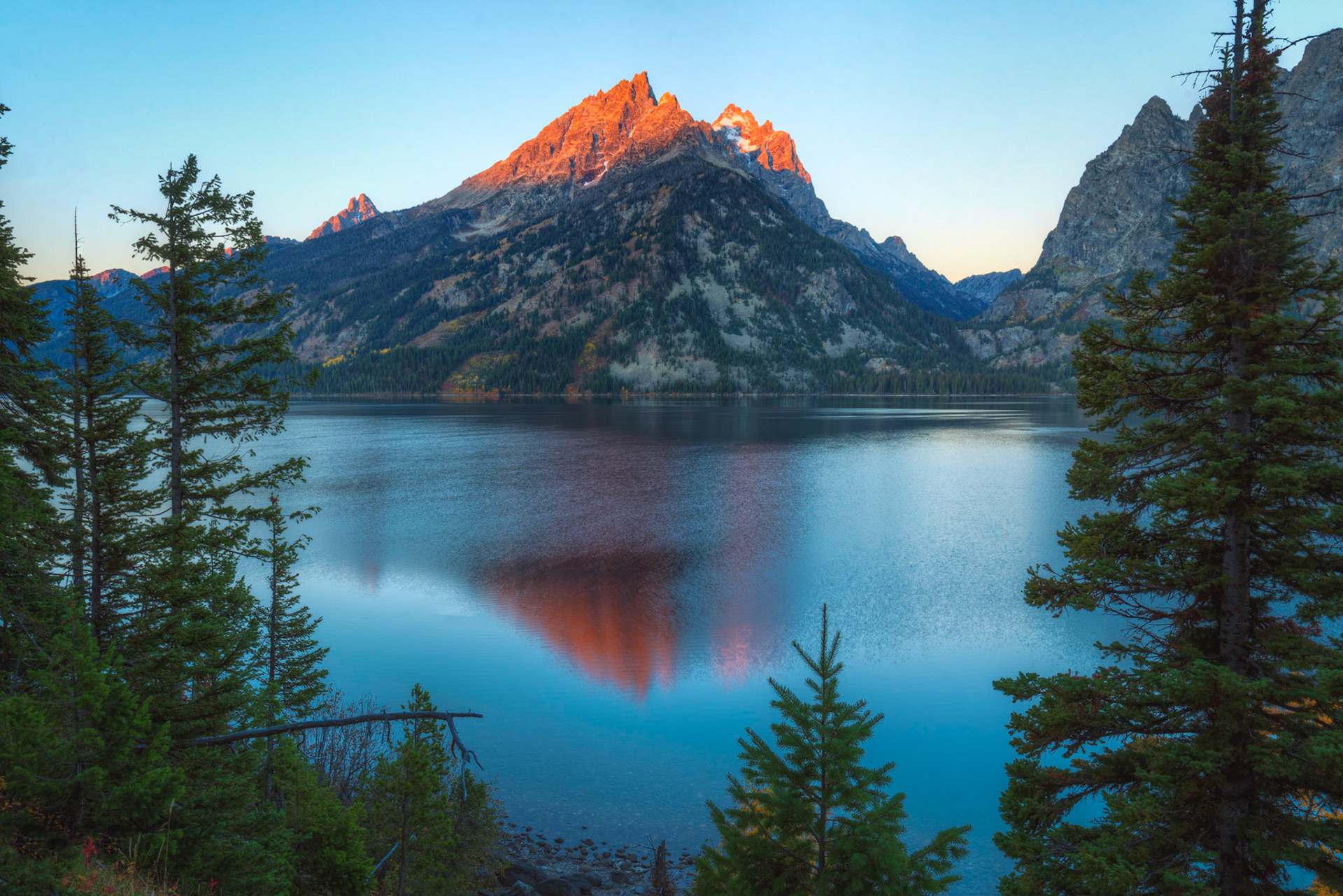 First light on the peaks of Teewinot Mountain, Mt. Owen, and (barely visible) the Grand Teton from the east shore of Jenny Lake.Grand Teton National ParkWyomingSeptember 28, 2016This is an HDR image consisting of 5 exposures merged in Photomatix Pro. Additional processing in Lightroom and Photoshop.PENTAX K-1, HD PENTAX-D FA 15-30mm F2.8ED SDM WRISO 100 24 mm  0.5 sec at ƒ / 18