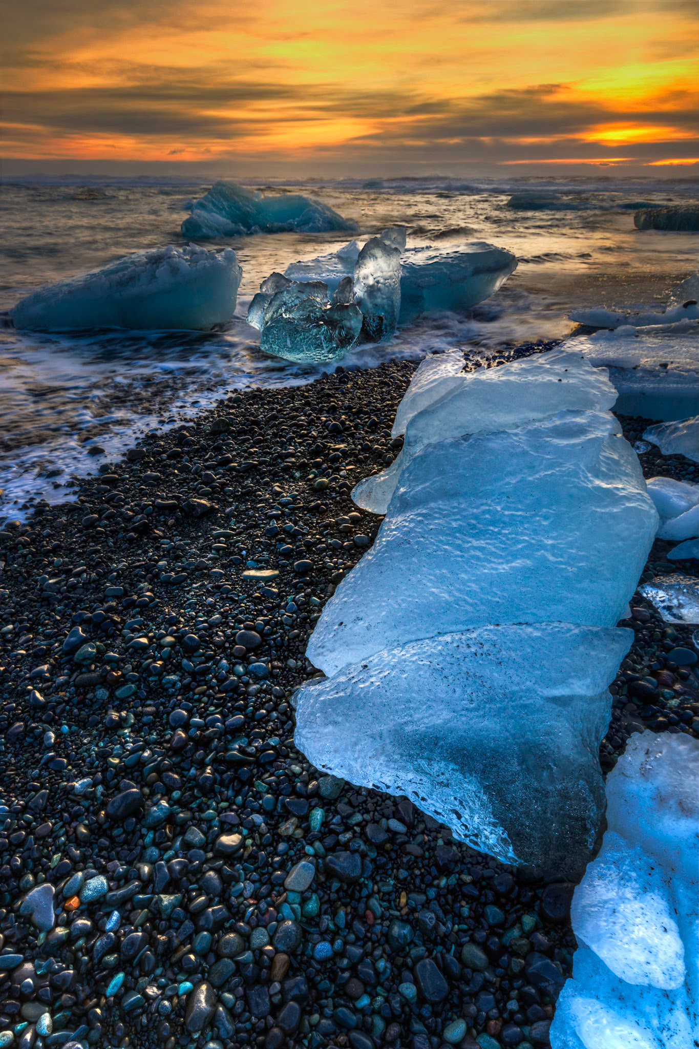 Sunrise at the ice beach at the outlet of Jökullsárlón.Austurland, IcelandFebruary 2, 2016This is an HDR image consisting of 5 exposures merged in Photomatix Pro. Additional processing in Lightroom and Photoshop.PENTAX K-3, Sigma 10-20mm f/4-5.6 EX DCISO 100 13 mm  0.4 sec at ƒ / 16