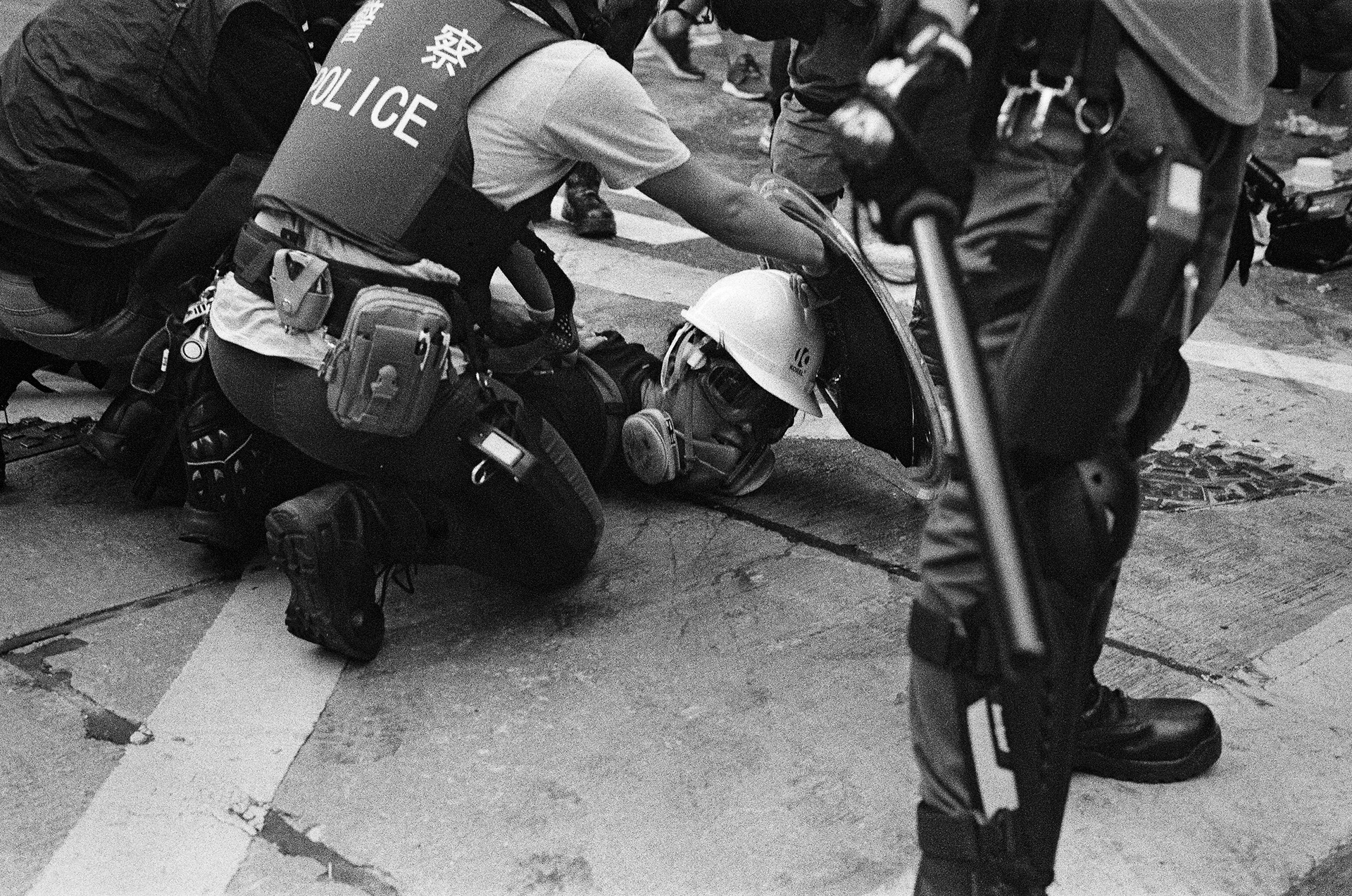 Busted: Admiralty, Hong Kong: A young protestor is arrested in Admiralty after a charge by riot police. Hong Kongers took to the streets in droves as their continued protest movement took on a new significance as it coincided with the 70th anniversary of the founding of the Peoples Republic of China. October 1st, 2019-Hong Kong, 35mm