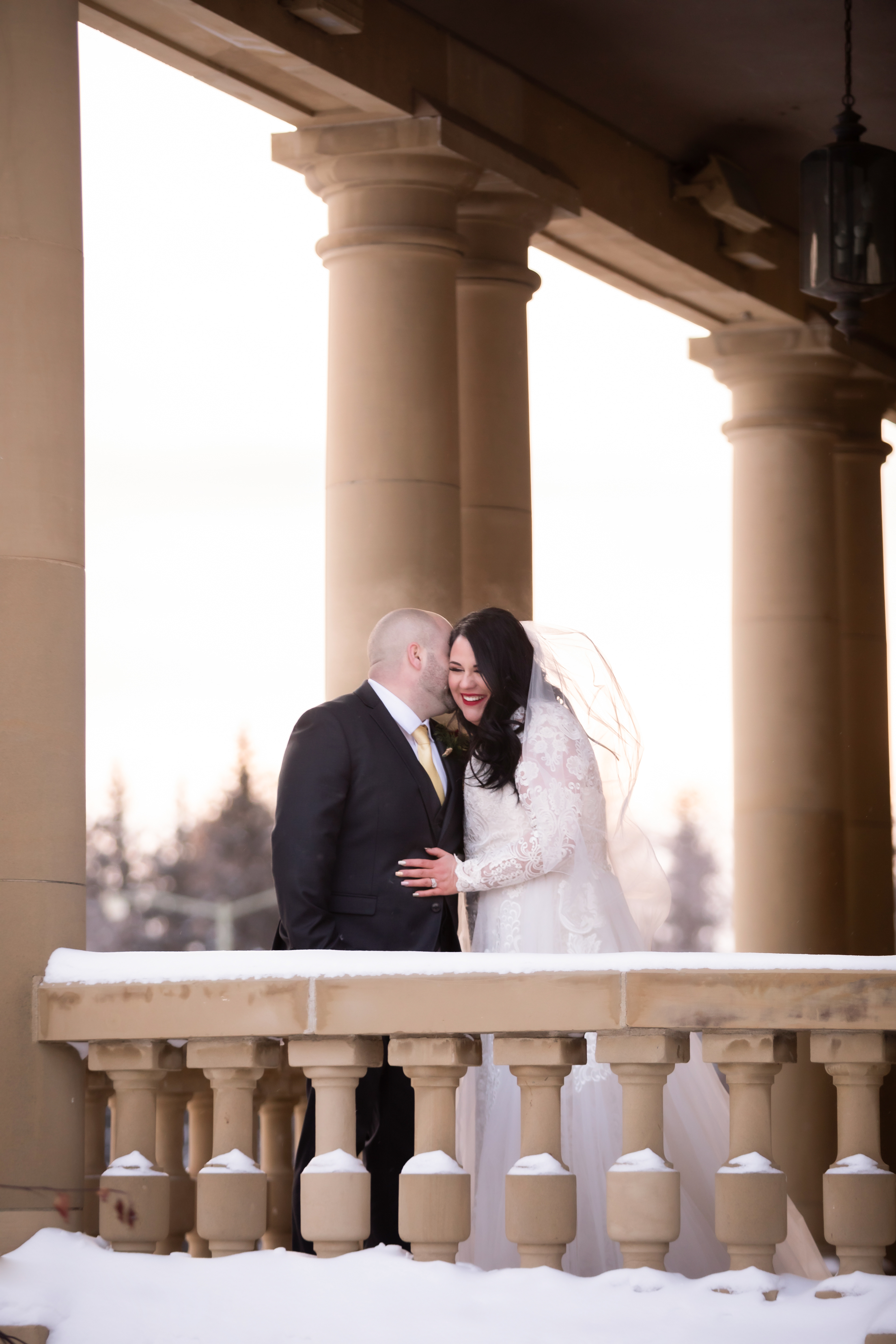Bride and groom in the winter at the government house in Edmonton