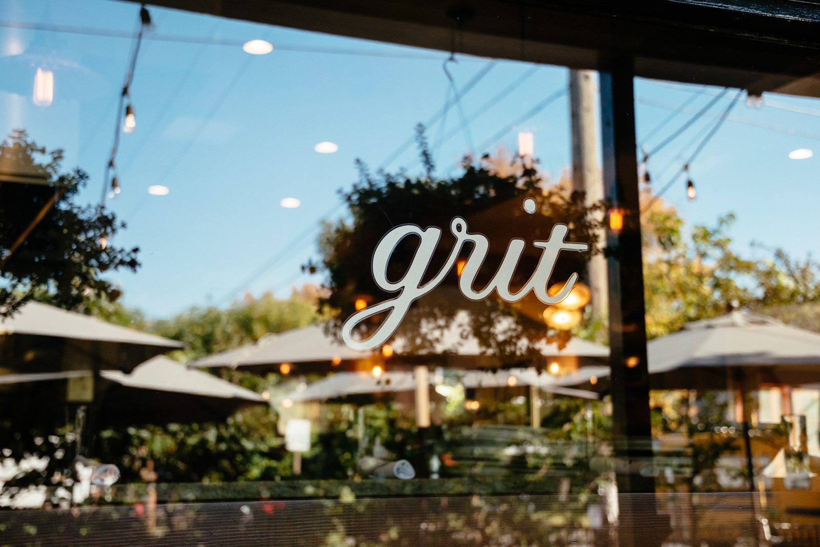Grit restaurant sign printed on window